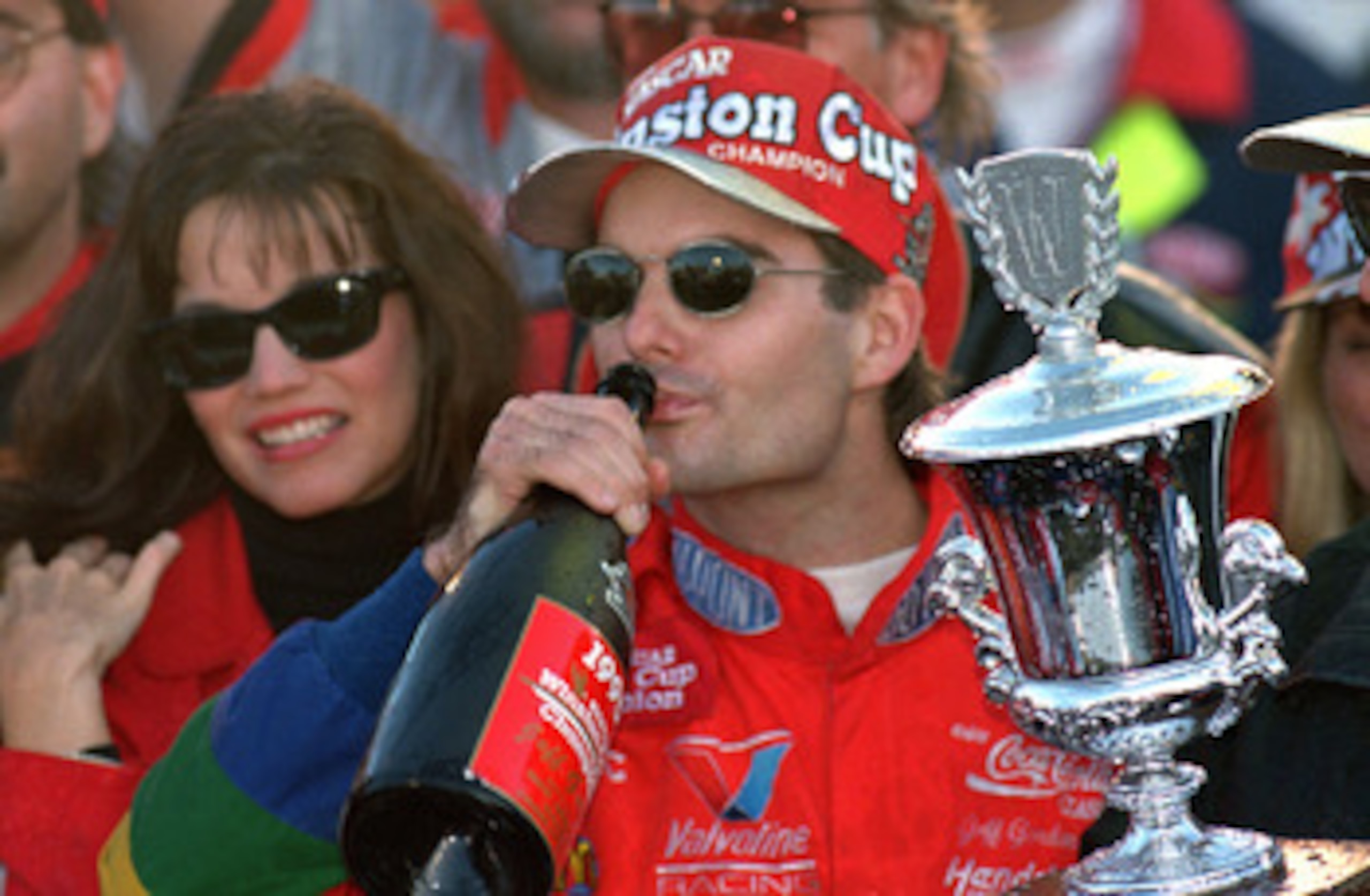 ATLANTA - NOVEMBER 12: Jeff Gordon of DuPont Chevrolet celebrates in victory lane drinking champagne after winning the Winston Cup championship in the NASCAR NAPA 500 at the Atlantic Motor Speedway on November 12, 1995 in Atlanta, Georgia. (Photo by Dav ATLANTA - NOVEMBER 12: Jeff Gordon of DuPont Chevrolet celebrates in victory lane drinking champagne after winning the Winston Cup championship in the NASCAR NAPA 500 at the Atlantic Motor Speedway on November 12, 1995 in Atlanta, Georgia. (Photo by Dav