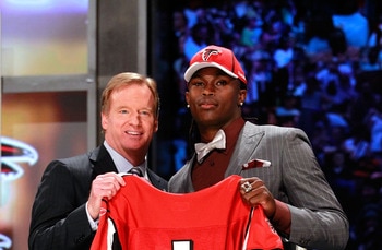 NEW YORK, NY - APRIL 28:  NFL Commissioner Roger Goodell (L) poses for a photo with Julio Jones, #6 overall pick by the Atlanta Falcons, holds up a jersey on stage during the 2011 NFL Draft at Radio City Music Hall on April 28, 2011 in New York City.  (Ph