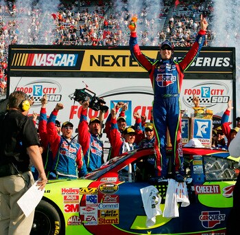 BRISTOL, TN - MARCH 25:  Kyle Busch, driver of the #5 Carquest/Kellogg's Chevrolet, celebrates in victory lane after winning the NASCAR Nextel Cup Series Food City 500 at Bristol Motor Speedway on March 25, 2007 in Bristol, Tennessee. Busch became the fir
