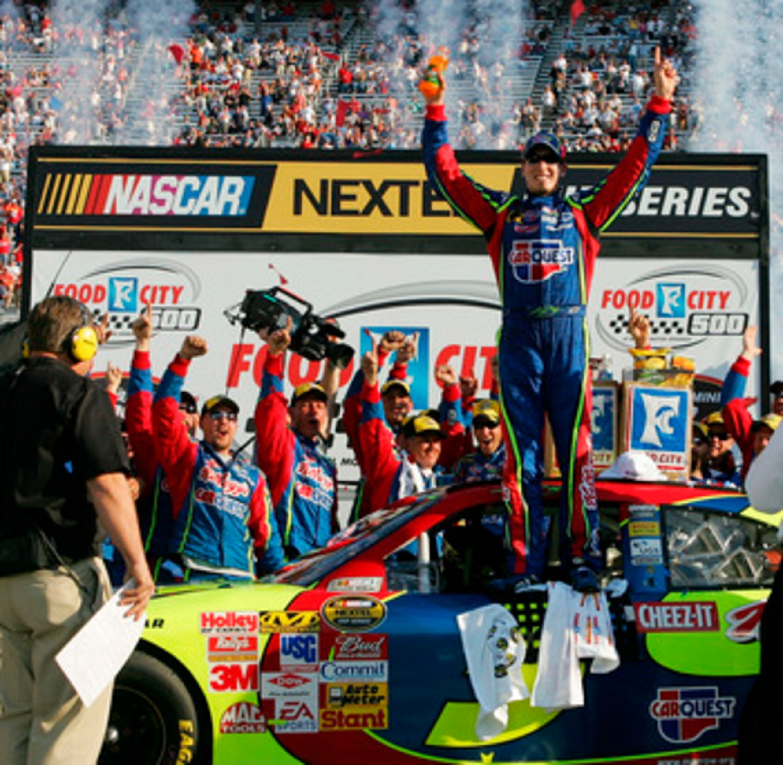BRISTOL, TN - MARCH 25: Kyle Busch, driver of the #5 Carquest/Kellogg's Chevrolet, celebrates in victory lane after winning the NASCAR Nextel Cup Series Food City 500 at Bristol Motor Speedway on March 25, 2007 in Bristol, Tennessee. Busch became the fir BRISTOL, TN - MARCH 25: Kyle Busch, driver of the #5 Carquest/Kellogg's Chevrolet, celebrates in victory lane after winning the NASCAR Nextel Cup Series Food City 500 at Bristol Motor Speedway on March 25, 2007 in Bristol, Tennessee. Busch became the fir