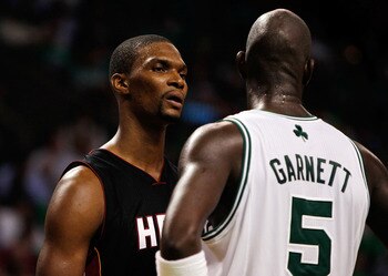 BOSTON, MA - OCTOBER 26: Chris Bosh #1 of the Miami Heat has words with Kevin Garnett #5 of the Boston Celtics at the TD Banknorth Garden on October 26, 2010 in Boston, Massachusetts.  The Heat lost 88-80. NOTE TO USER: User expressly acknowledges and agr