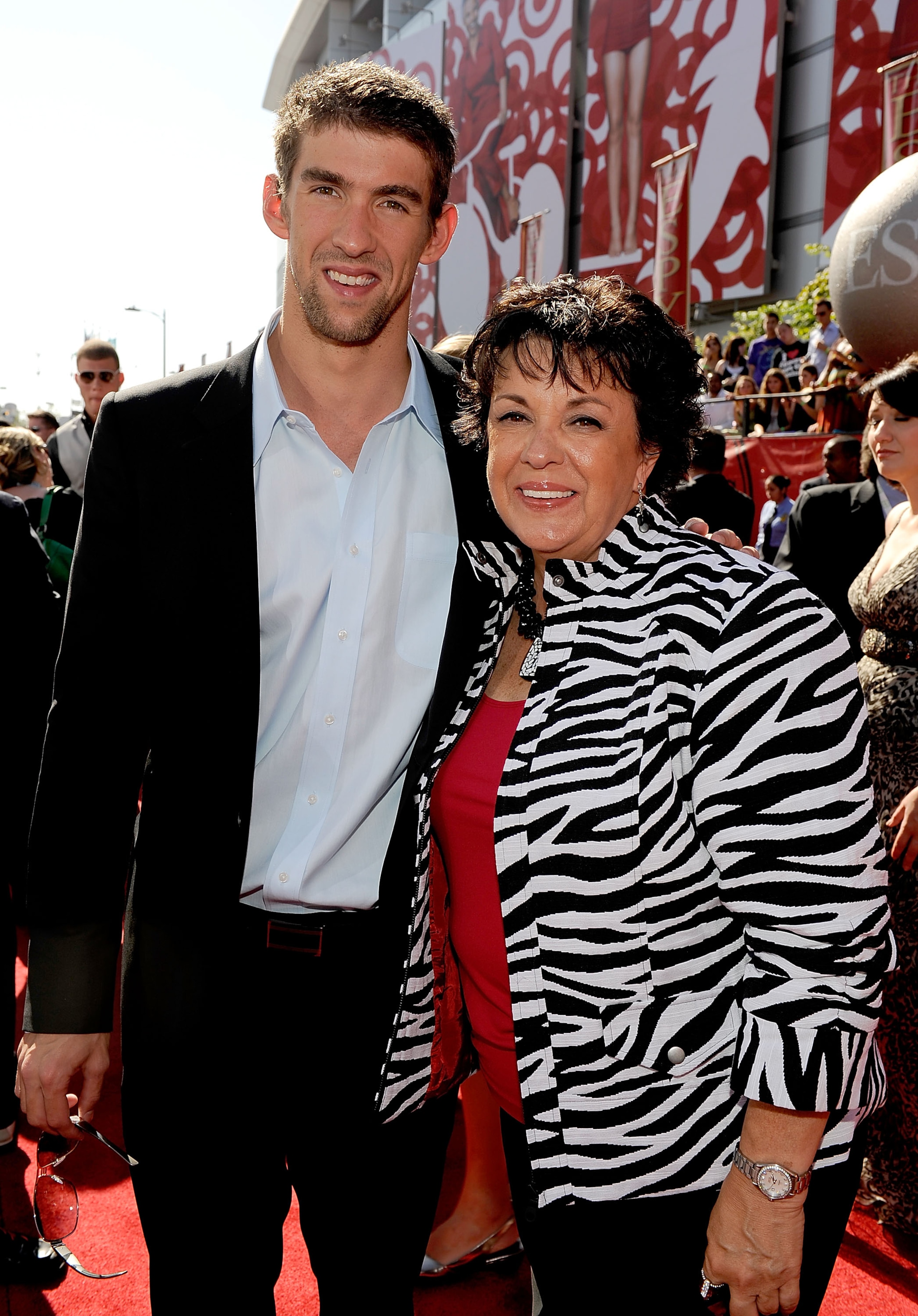 LOS ANGELES, CA - JULY 15:  Olympic Gold Medalist Michael Phelps (L) and his mother Debbie Davisson Phelps arrive at the 2009 ESPY Awards held at Nokia Theatre LA Live on July 15, 2009 in Los Angeles, California. The 17th annual ESPYs will air on Sunday,