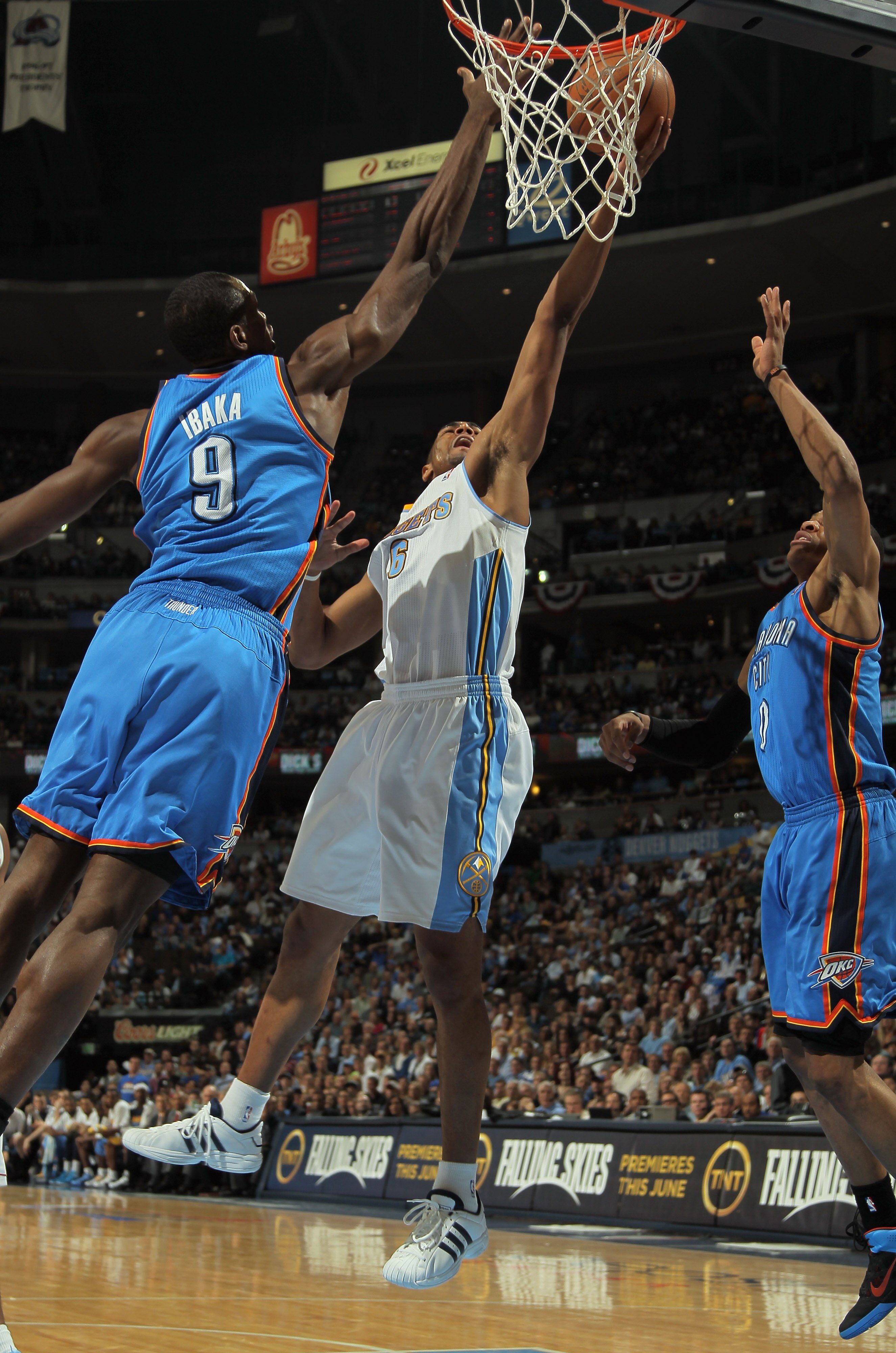DENVER, CO - APRIL 25:  Arron Afflalo #6 of the Denver Nuggets lays up a shot between Serge Ibaka #9 of the Oklahoma City Thunder and Russell Westbrook #0 of the Oklahoma City Thunder in Game Four of the Western Conference Quarterfinals in the 2011 NBA Pl