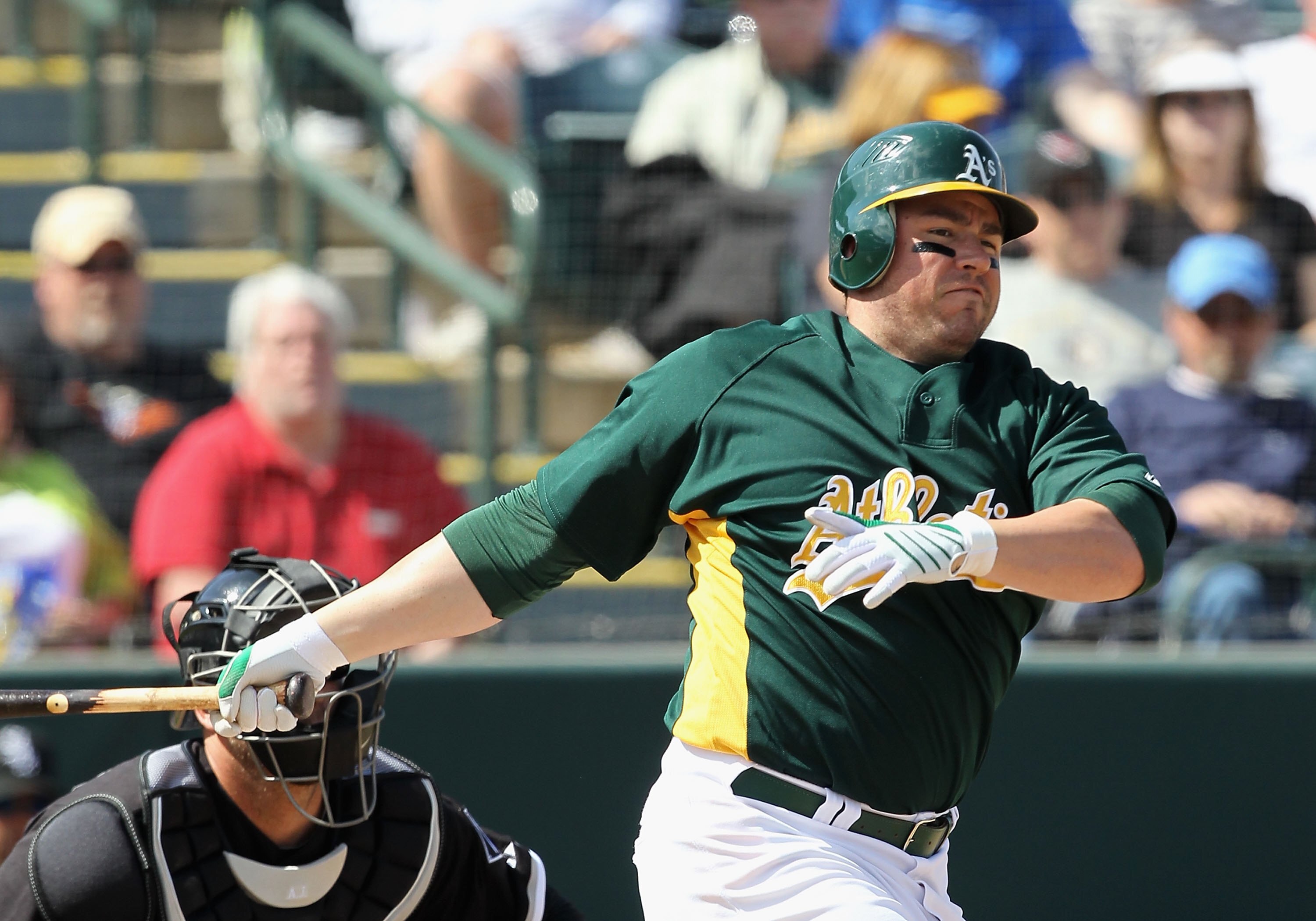 PHOENIX - MARCH 10:  Jack Cust #32 of the Oakland Athletics bats against the Chicago White Sox during the MLB spring training game at Phoenix Municipal Stadium on March 10, 2010 in Phoenix, Arizona. The White Sox defeated the A's 9-5  (Photo by Christian