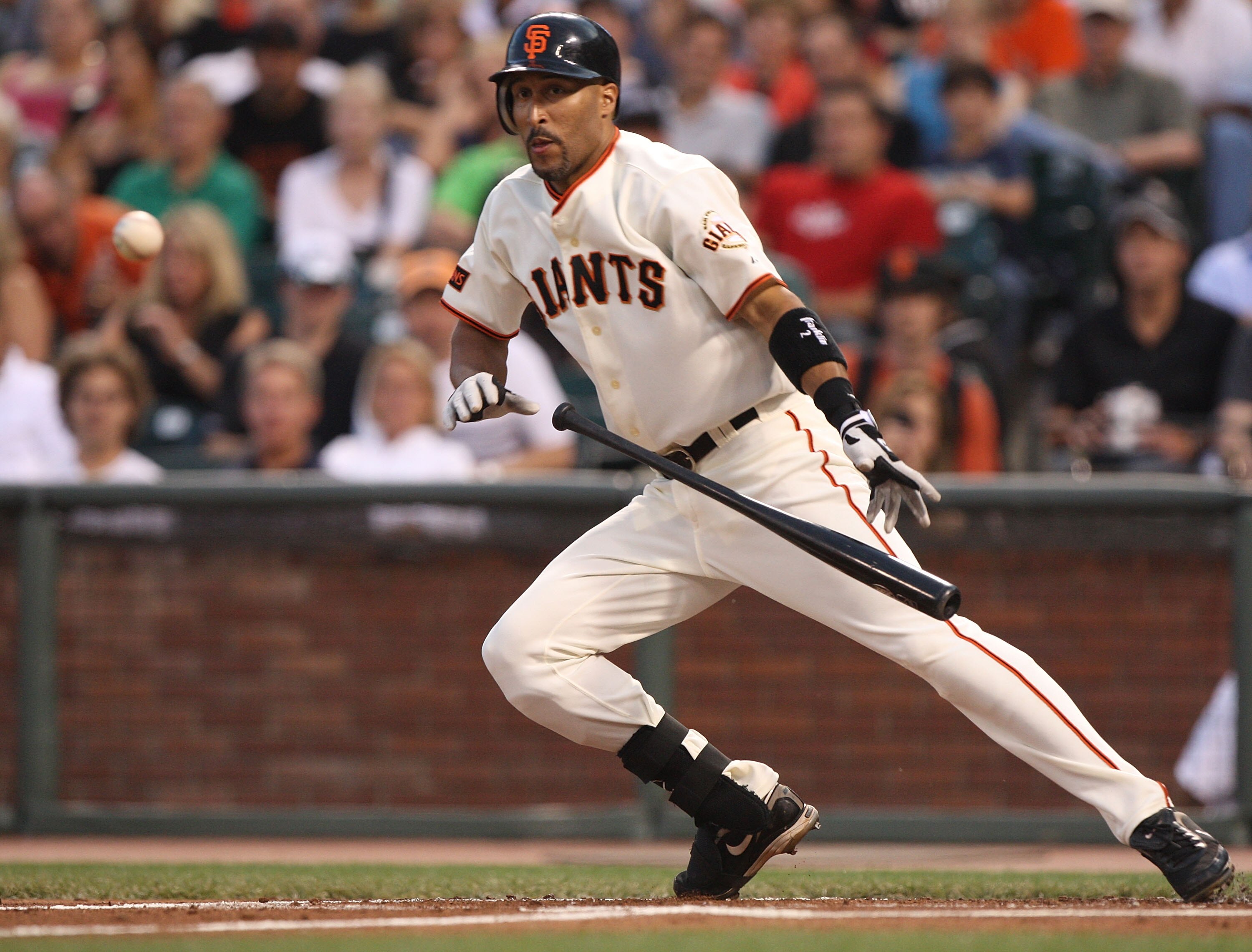 SAN FRANCISCO - AUGUST 28:  Randy Winn #2 of the San Francisco Giants lays down a sacrafice bunt in the first inning against the Colorado Rockies during a Major League Baseball game at AT&T Park on August 28, 2009 in San Francisco, California.  (Photo by