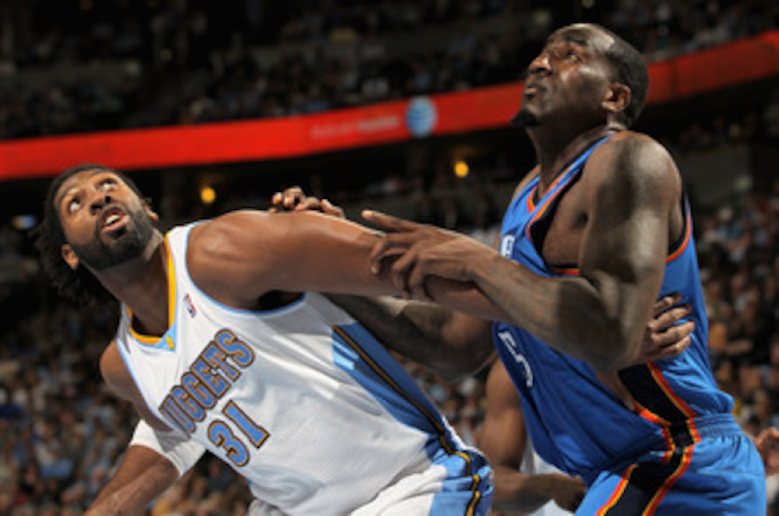 DENVER, CO - APRIL 25:  Nene Hilario #31 of the Denver Nuggets and Kendrick Perkins #5 of the Oklahoma City Thunder battle for rebounding position in Game Four of the Western Conference Quarterfinals in the 2011 NBA Playoffs on April 24, 2011 at the Pepsi