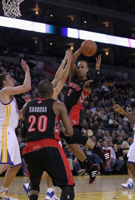 OAKLAND, CA - MARCH 25: Jerryd Bayless #5 of the Toronto Raptors passes the ball during their game against the Golden State Warriors at Oracle Arena on March 25, 2011 in Oakland, California. NOTE TO USER: User expressly acknowledges and agrees that, by do