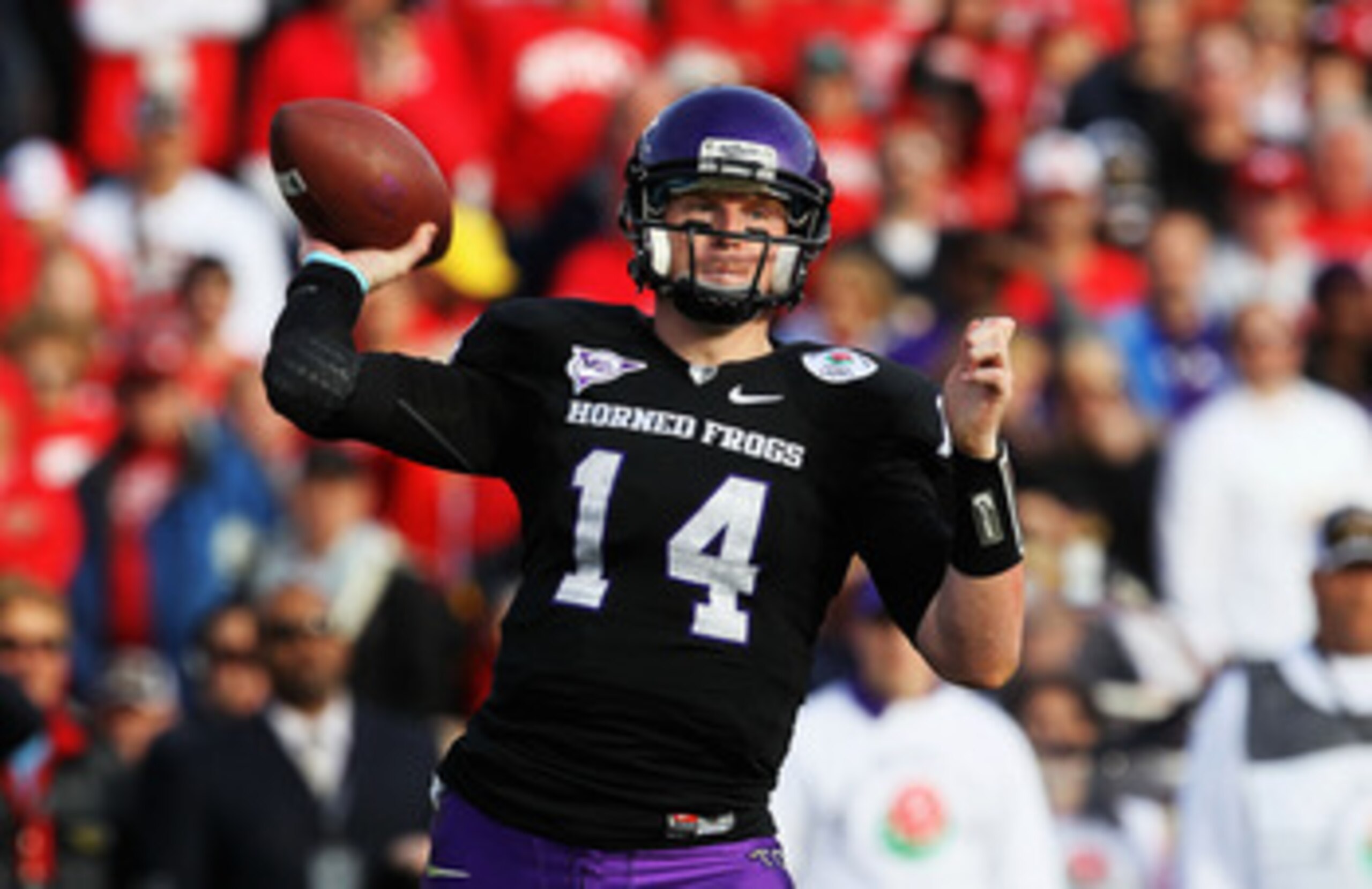 PASADENA, CA - JANUARY 01:  Quarterback Andy Dalton #14 of the TCU Horned Frogs looks to pass against the Wisconsin Badgers during the 97th Rose Bowl game on January 1, 2011 in Pasadena, California.  (Photo by Stephen Dunn/Getty Images)