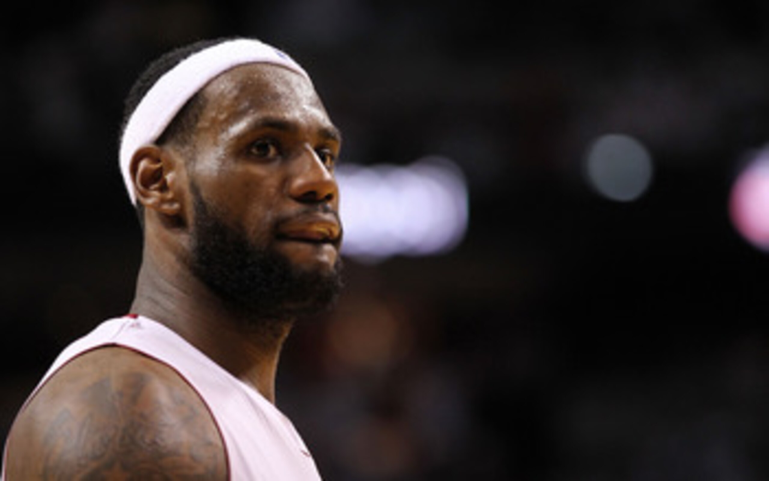 MIAMI, FL - APRIL 27:   LeBron James #6 of the Miami Heat looks on during game five of the Eastern Conference Quarterfinals in the 2011 NBA Playoffs against the Philadelphia 76ers at American Airlines Arena on April 27, 2011 in Miami, Florida. NOTE TO USE