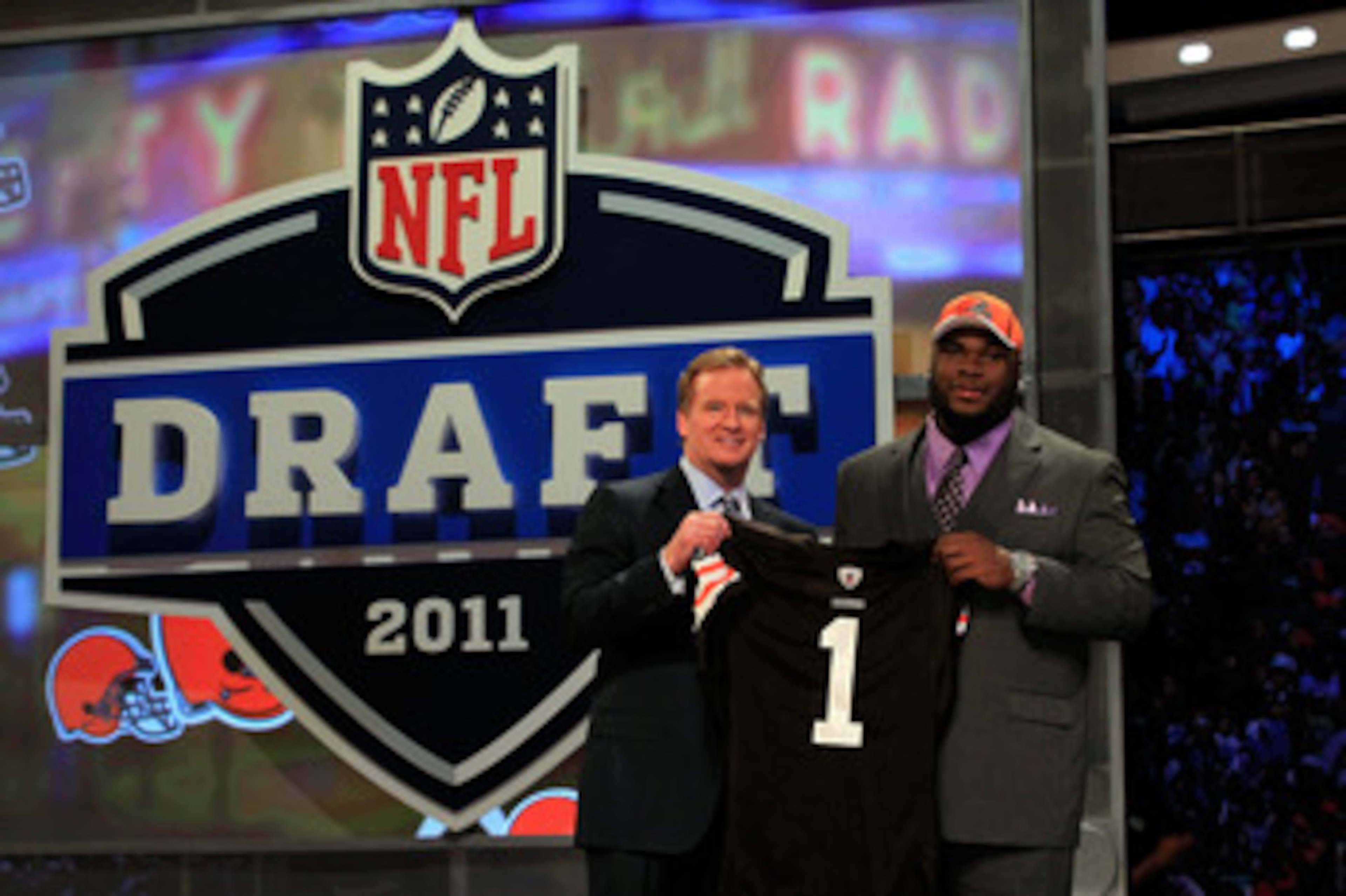 NEW YORK, NY - APRIL 28:  NFL Commissioner ROger Goodell (L) poses for a photo with Phil Taylor, #21 overall pick by the Cleveland Browns, on stage during the 2011 NFL Draft at Radio City Music Hall on April 28, 2011 in New York City.  (Photo by Chris Tro