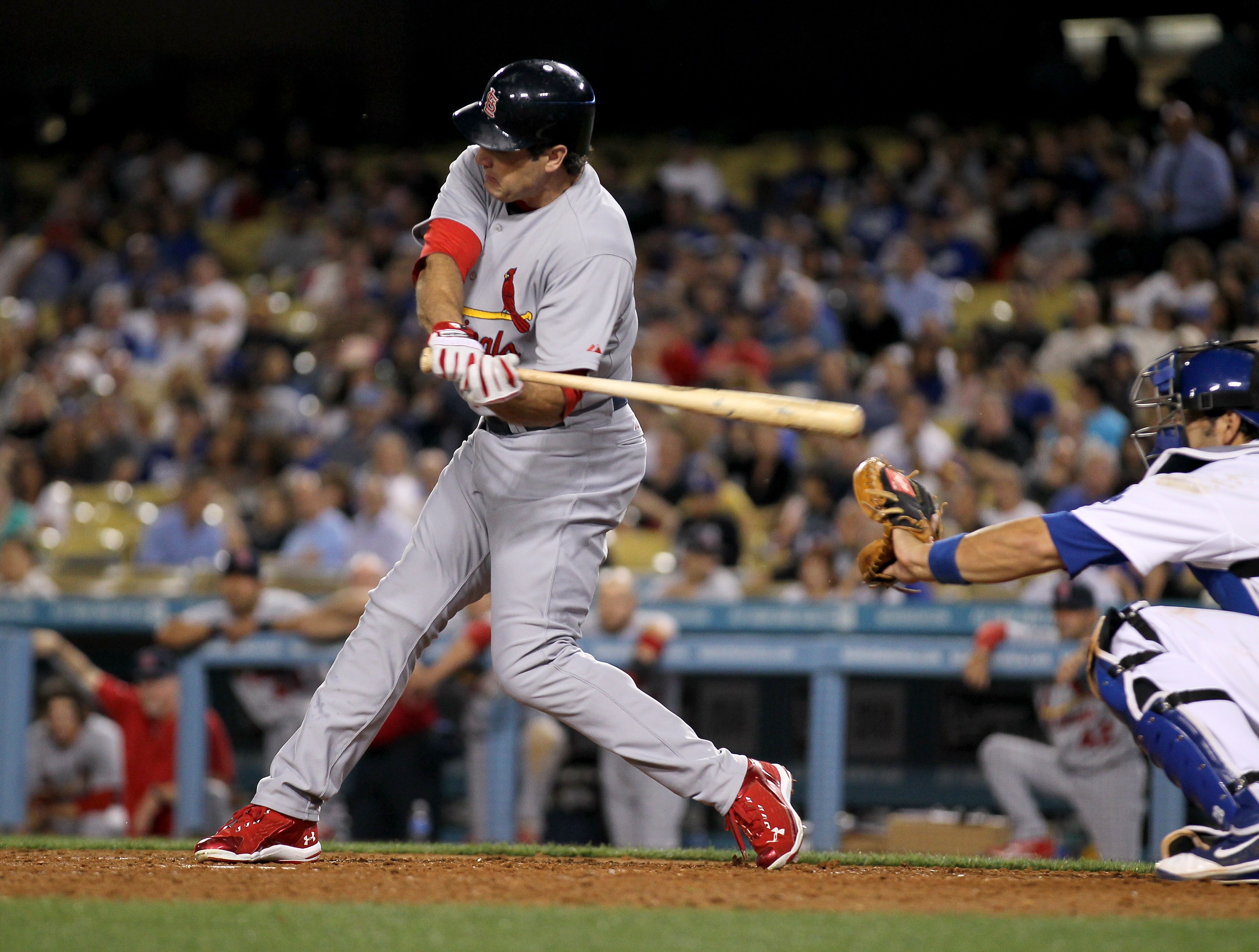 LOS ANGELES - APRIL 15: Lance Berkman #12 of the St. Louis Cardinals hits his second home run of the game in the fourth inning against the Los Angeles Dodgers on April 15, 2011 at Dodger Stadium in Los Angeles, California.   (Photo by Stephen Dunn/Getty I