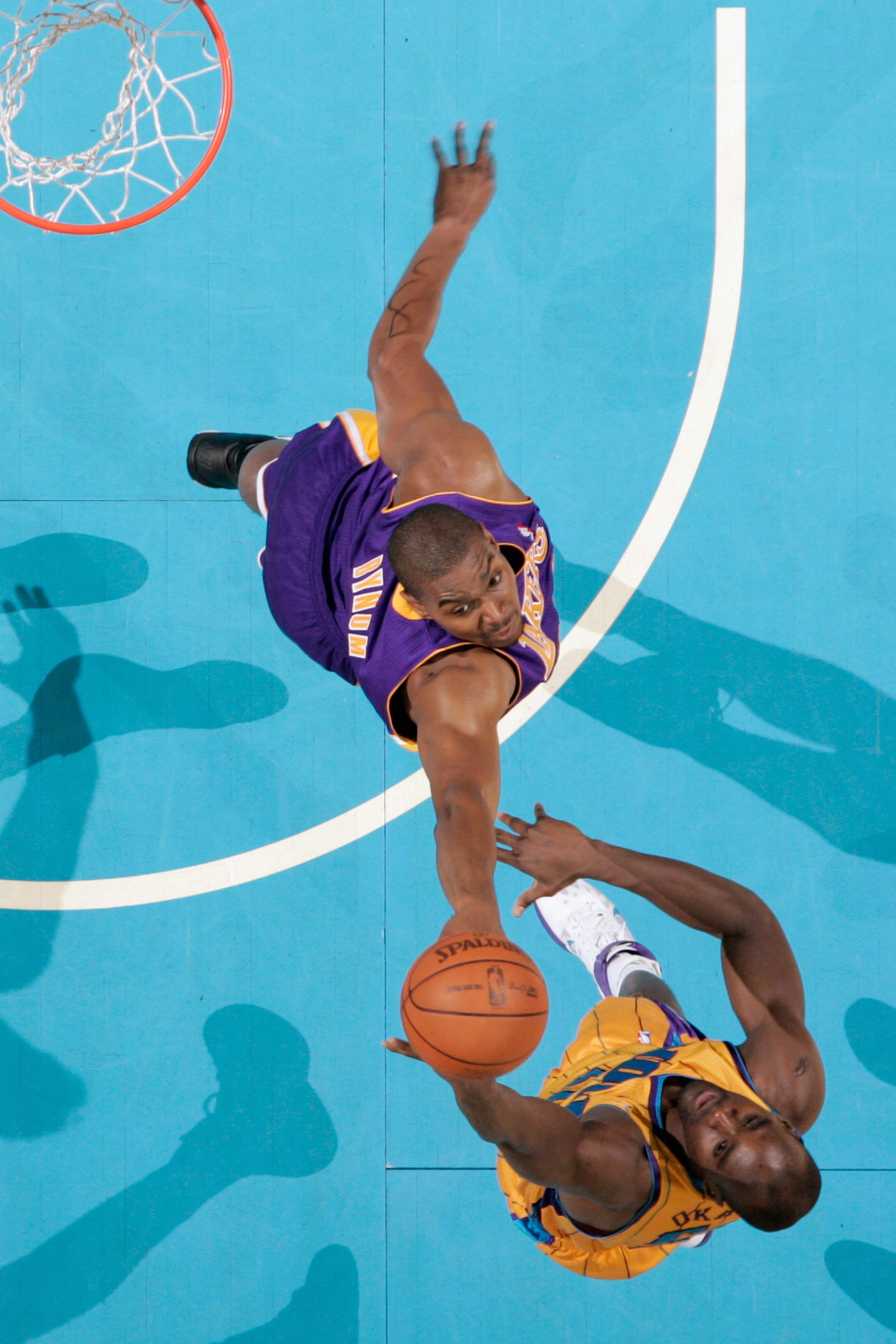 NEW ORLEANS, LA - APRIL 22:  Emeka Okafor #50 of the New Orleans Hornets shoots the ball over Andrew Bynum #17 of the Los Angeles Lakers in Game Three of the Western Conference Quarterfinals in the 2011 NBA Playoffs at the New Orleans Arena  on April 22,