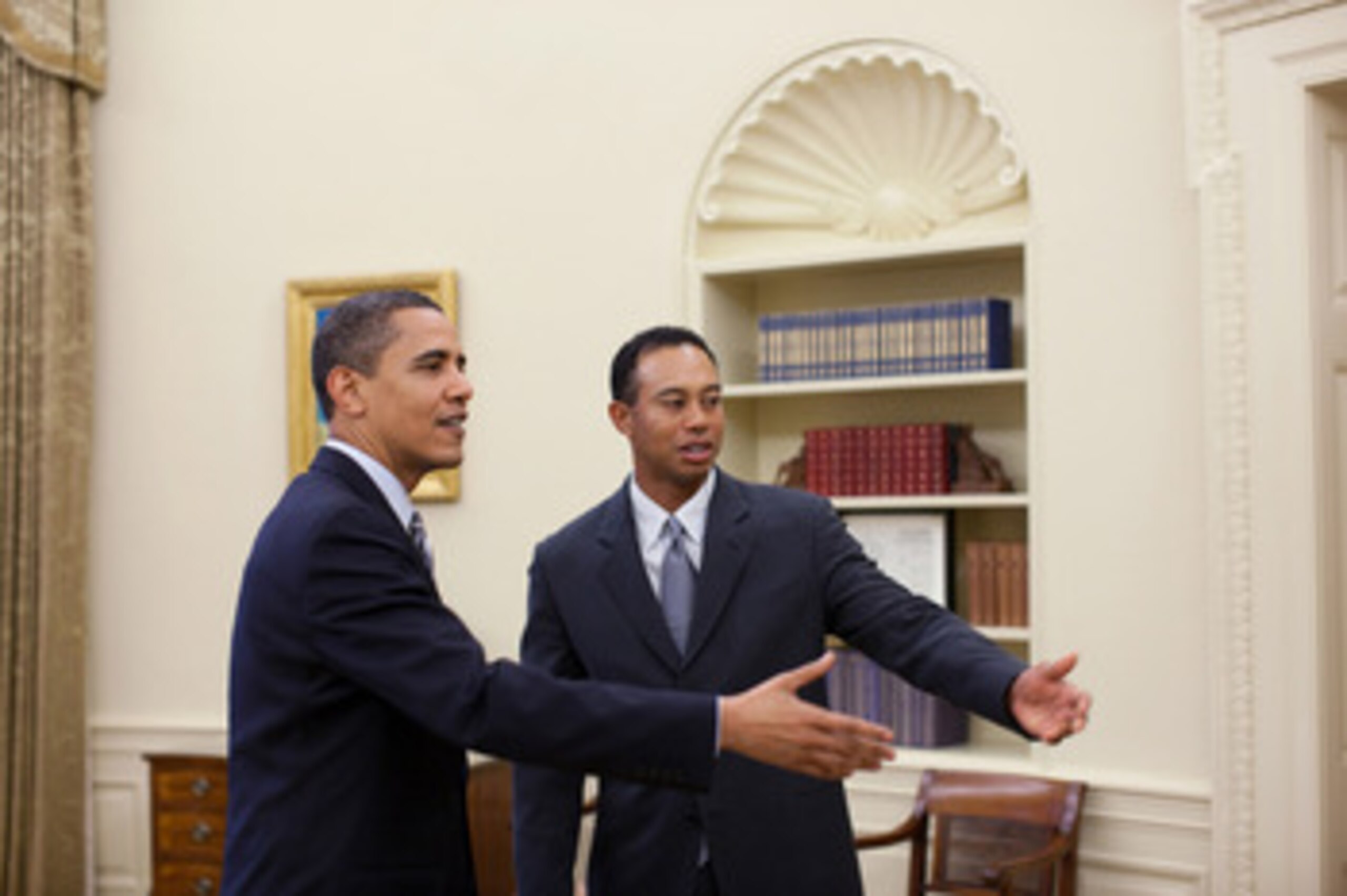 WASHINGTON - APRIL 20:  In this handout released today by the White House, U.S.  President Barack Obama (L) talks with professional golfer Tiger Woods in the Oval Office of the White House on April 20, 2009 in Washington, DC. The 14-time major winner visi