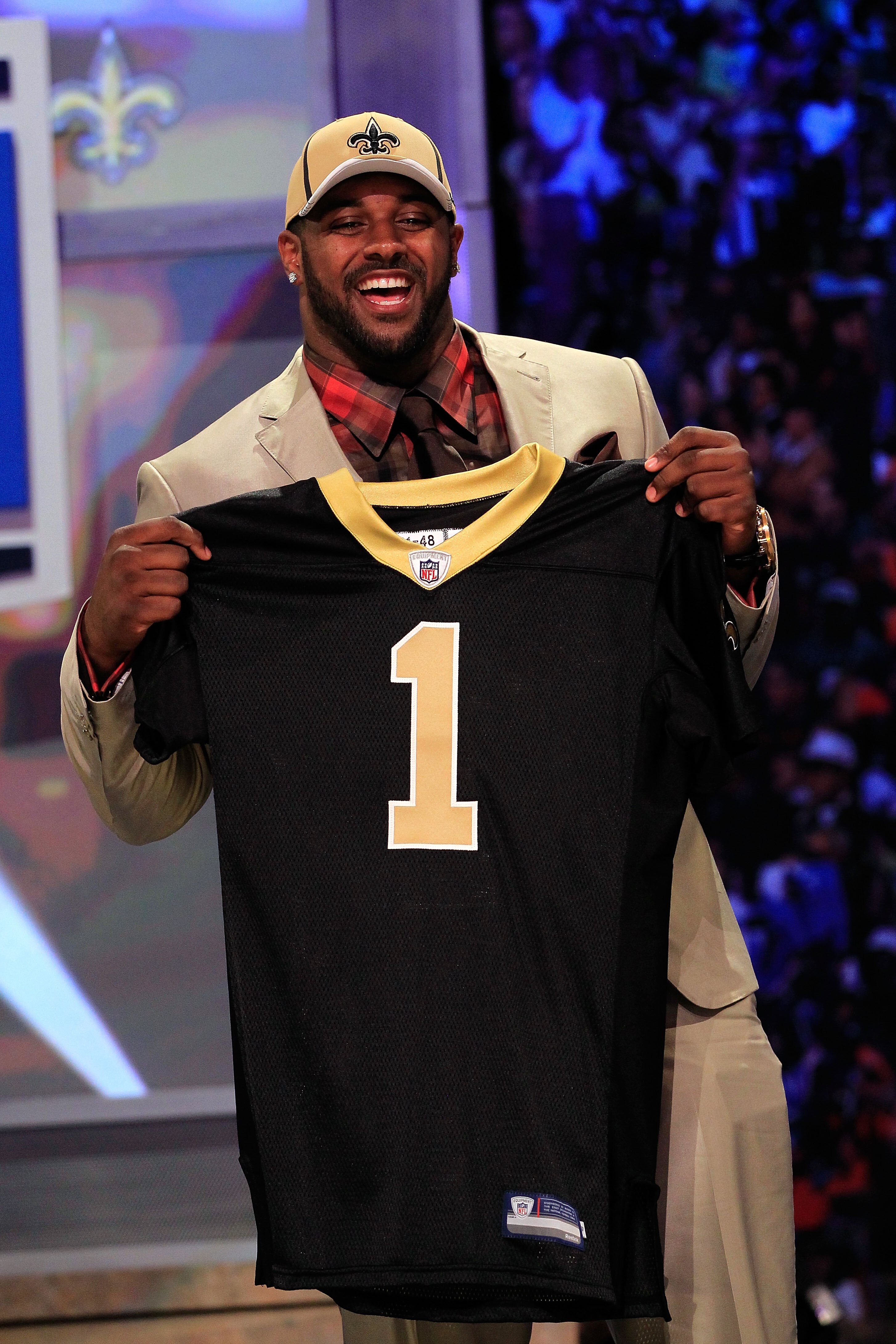 NEW YORK, NY - APRIL 28:  Cameron Jordan, #24 overall pick by the New Orleans Saints, holds up a jersey on stage during the 2011 NFL Draft at Radio City Music Hall on April 28, 2011 in New York City.  (Photo by Chris Trotman/Getty Images)