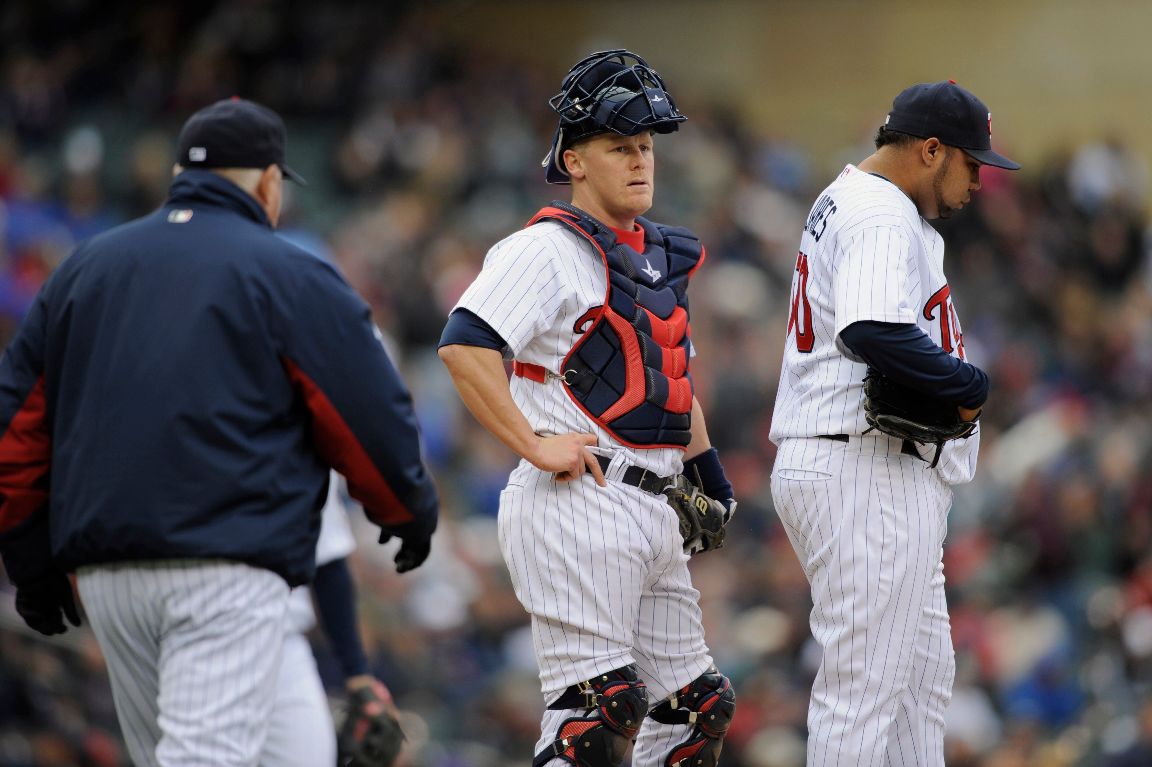 MINNEAPOLIS, MN - APRIL 28: Manager Ron Gardenhire #35 walks out to the mound to reliever pitcher Jose Mijares #50 of the Minnesota Twins while catcher Steve Holm #27 looks on during in the seventh inning of their game against the Tampa Bay Rays on April 