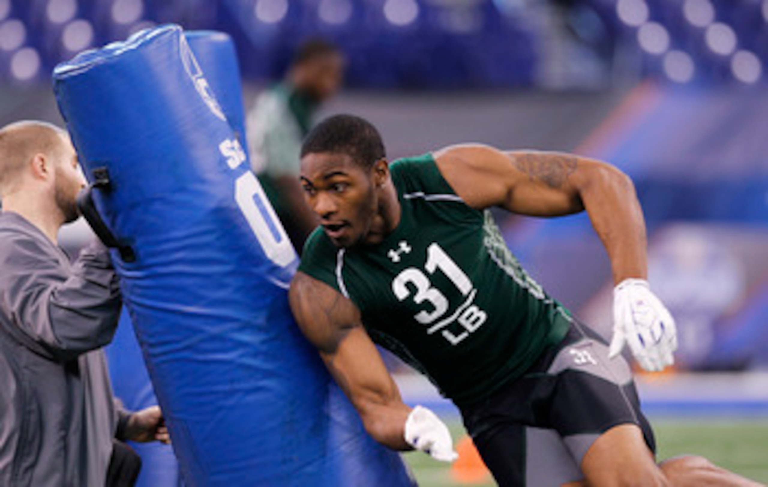 INDIANAPOLIS, IN - FEBRUARY 28: Martez Wilson of Illinois works out during the 2011 NFL Scouting Combine at Lucas Oil Stadium on February 28, 2011 in Indianapolis, Indiana. (Photo by Joe Robbins/Getty Images)