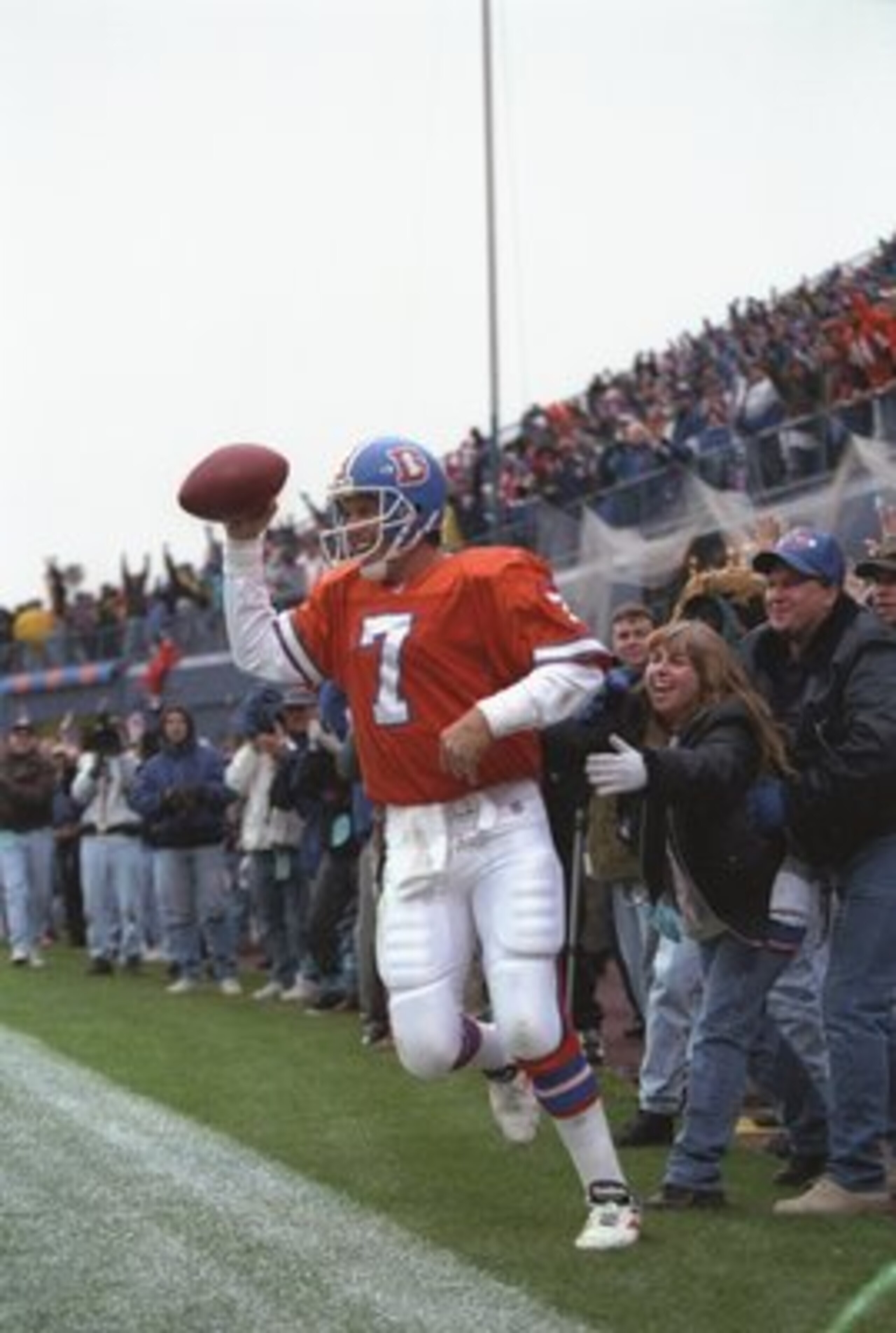 20 Oct 1996:  Quarterback John Elway of the Denver Broncos celebrates after scoring the winning touchdown during the Broncos 45-34 win over the Baltimore Ravens at Mile High Stadium in Denver, Colorado.  Mandatory Credit: Brian Bahr  /Allsport