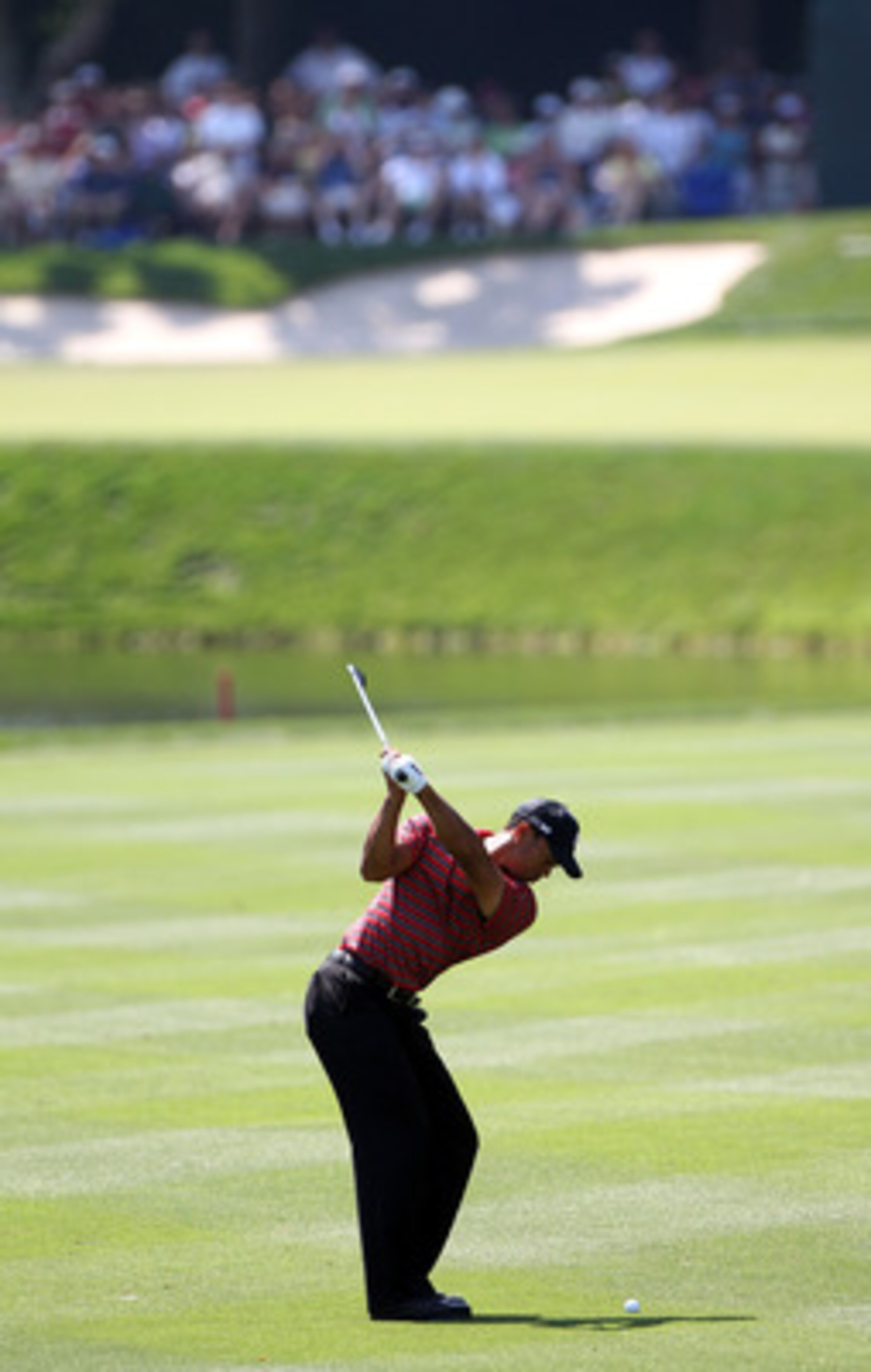 ORLANDO, FL - MARCH 27:  Tiger Woods plays a shot on the 8th hole during the final round of the Arnold Palmer Invitational presented by MasterCard at the Bay Hill Club and Lodge on March 27, 2011 in Orlando, Florida.  (Photo by Sam Greenwood/Getty Images)