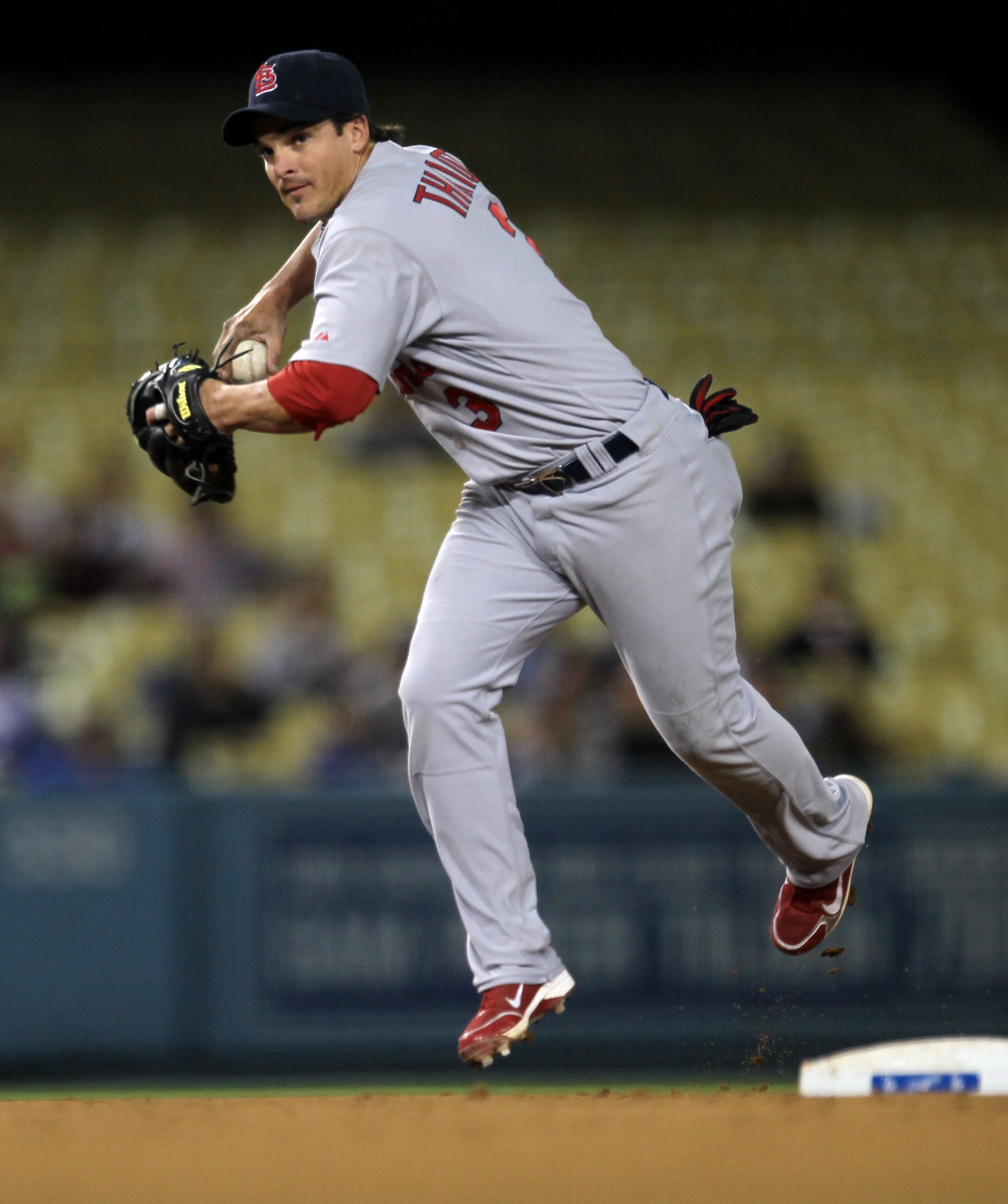 LOS ANGELES - APRIL 14: Shortstop Ryan Theriot #3 of the St Louis Cardinals makes a play against the Los Angeles Dodgers on April 14, 2011 at Dodger Stadium in Los Angeles, California.  (Photo by Stephen Dunn/Getty Images)