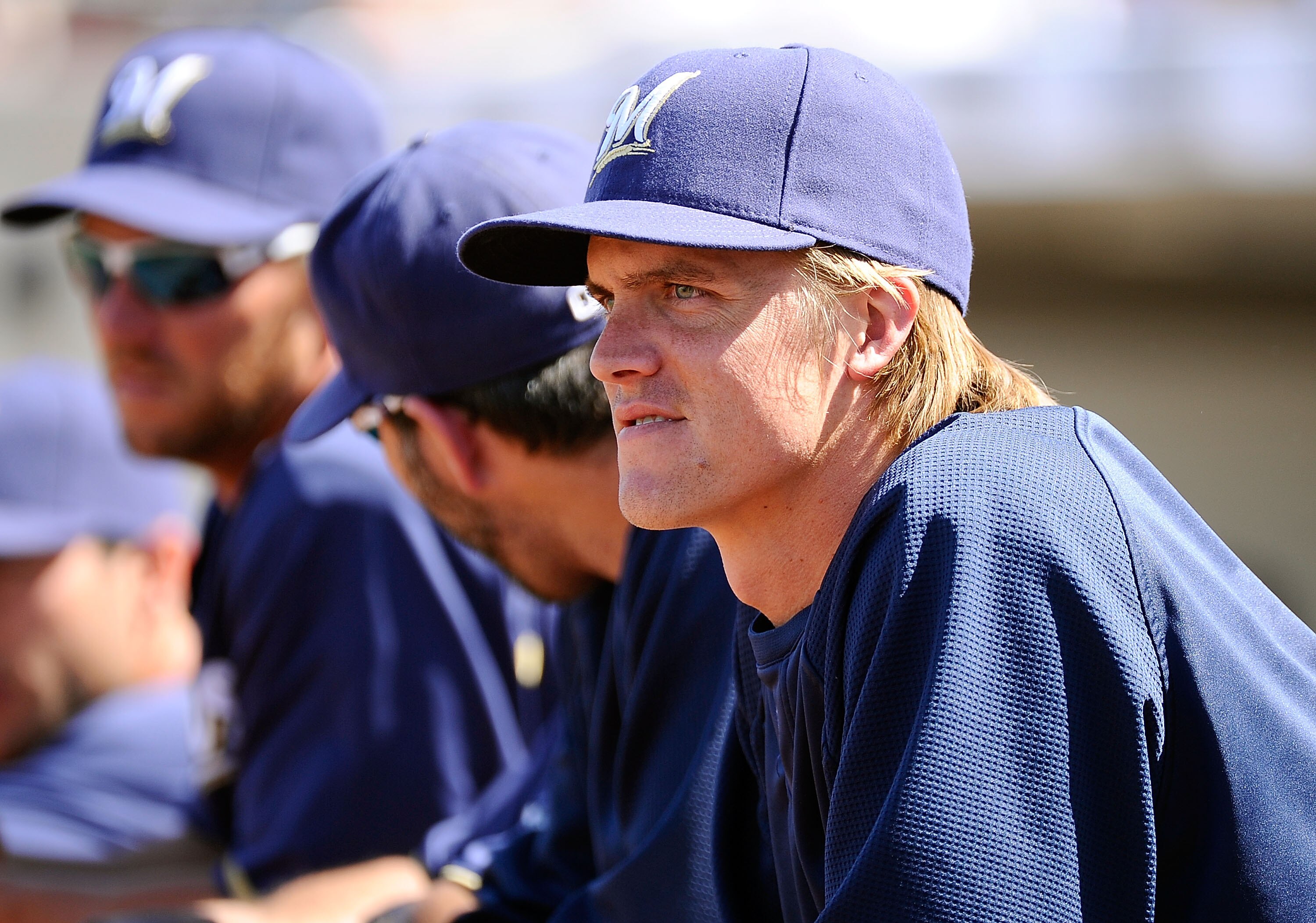 PHOENIX, AZ - MARCH 10:  Pitcher Zack Greinke #13  of the Milwaukee Brewers looks on during the spring training baseball game against Colorado Rockies at Maryvale Baseball Park on March 10, 2011 in Phoenix, Arizona.  (Photo by Kevork Djansezian/Getty Imag