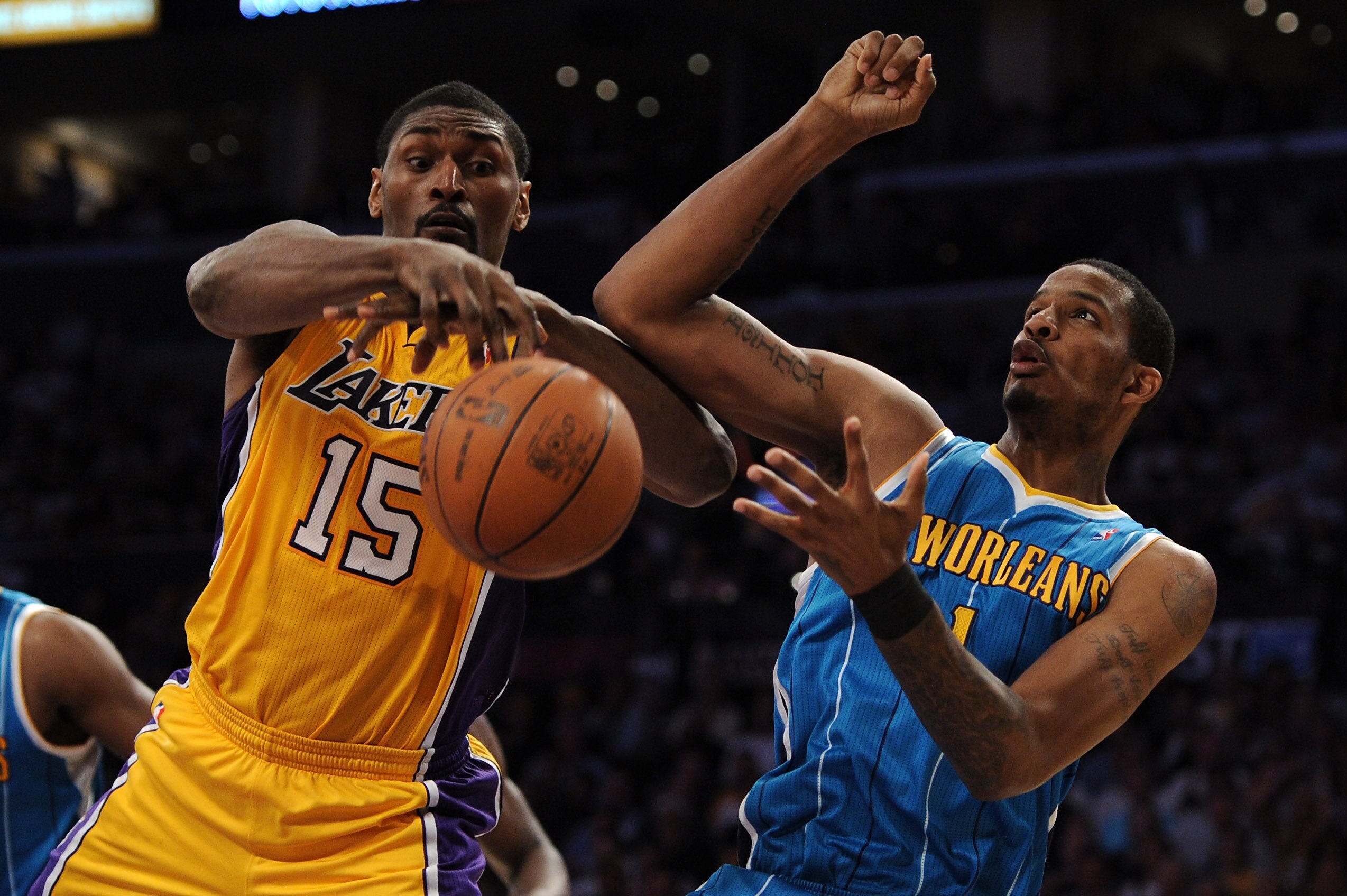LOS ANGELES, CA - APRIL 26:  Ron Artest #15 of the Los Angeles Lakers goes for the ball against Trevor Ariza #1 of the New Orleans Hornets in the second quarter of Game Five of the Western Conference Quarterfinals in the 2011 NBA Playoffs on April 26, 201