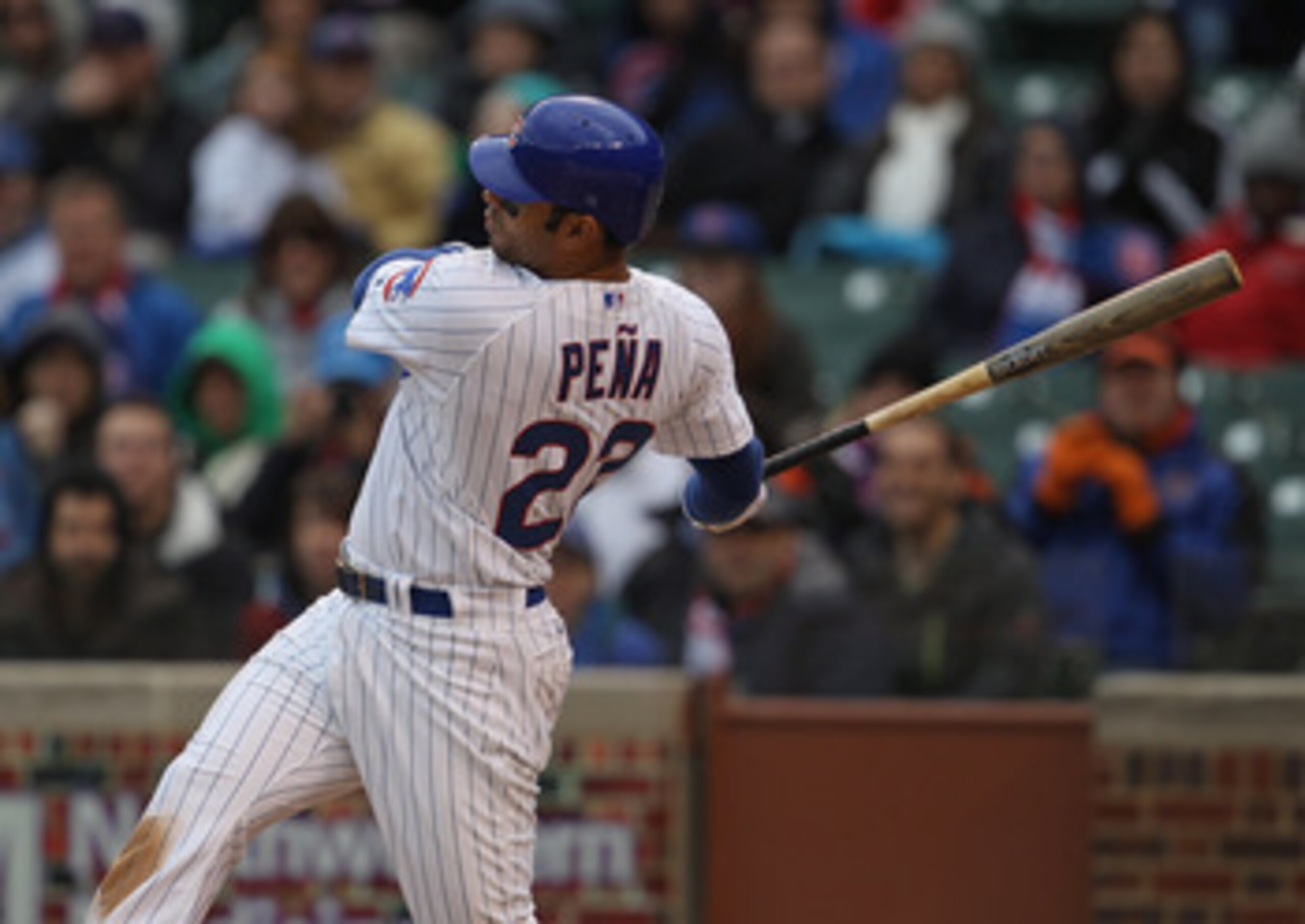 CHICAGO, IL - APRIL 20: Carlos Pena #22 of the Chicago Cubs takes a swing against the San Diego Padres at Wrigley Field on April 20, 2011 in Chicago, Illinois. The Cubs defeated the Padres 2-1 in 11 innings. (Photo by Jonathan Daniel/Getty Images)