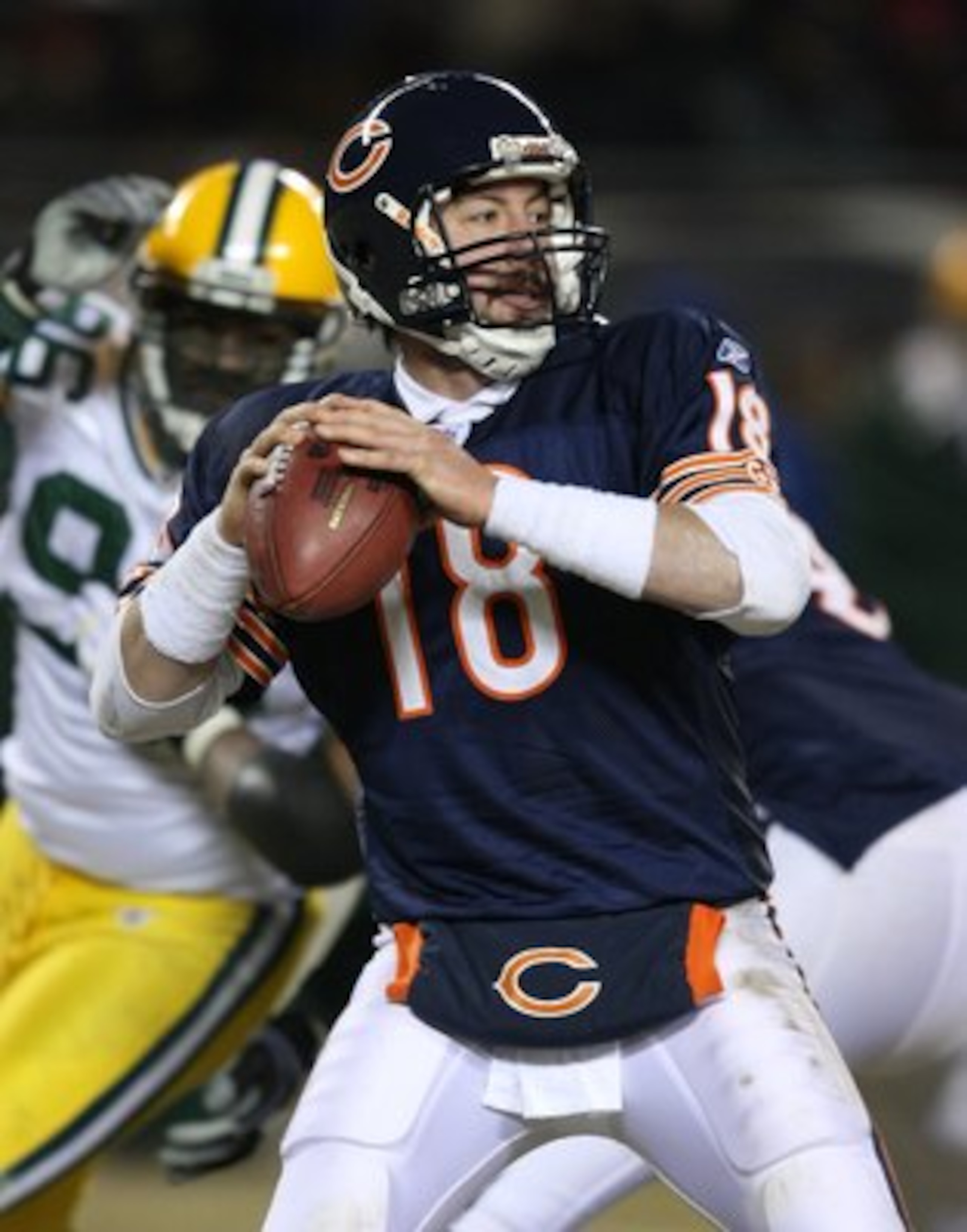 CHICAGO - DECEMBER 22: Kyle Orton #18 of the Chicago Bears looks for a receiver against the Green Bay Packers on December 22, 2008 at Soldier Field in Chicago, Illinois. The Bears defeated the Packers 20-17 in overtime. (Photo by Jonathan Daniel/Getty Ima