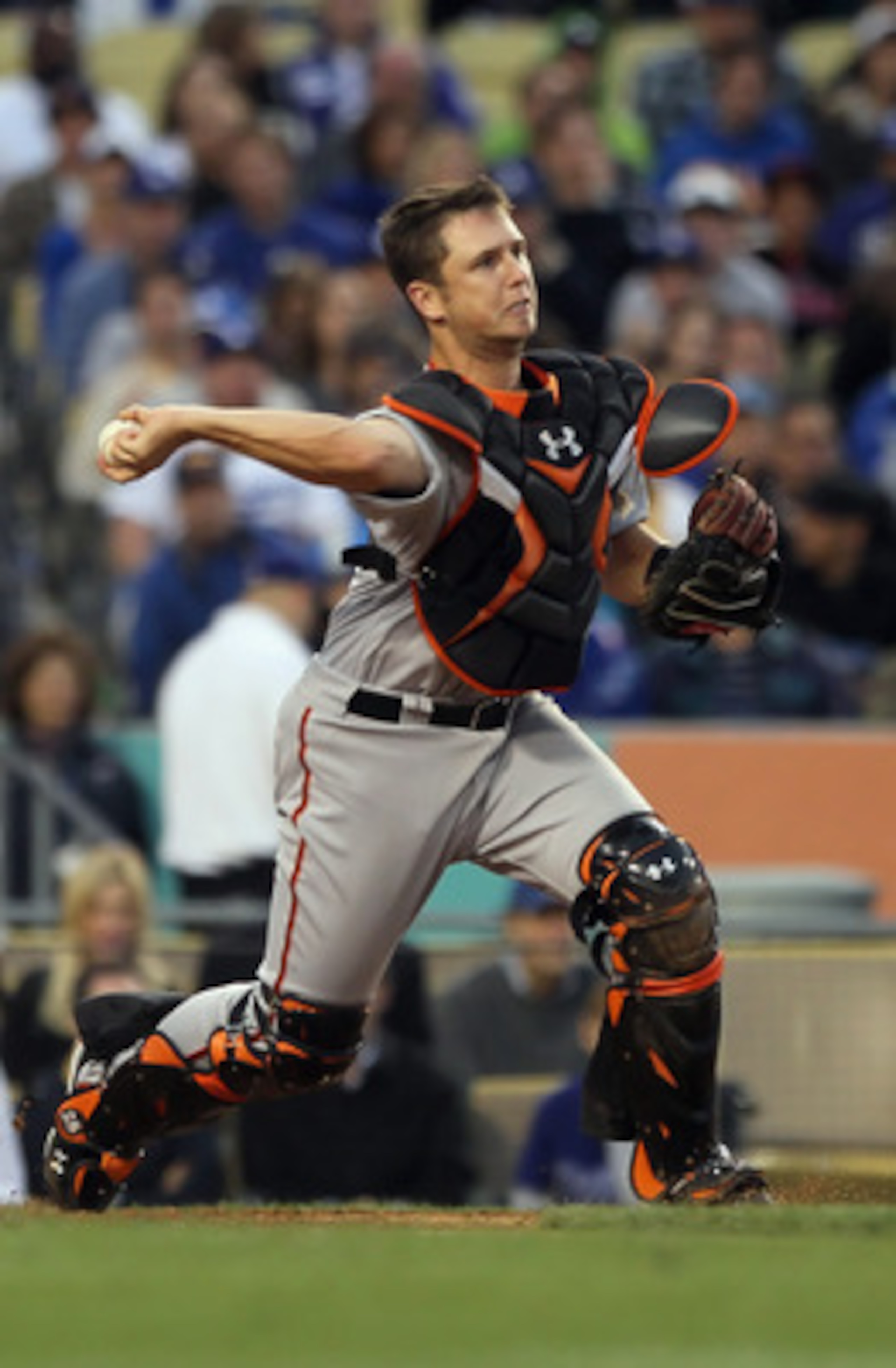LOS ANGELES, CA - APRIL 03:  Buster Posey #28 of the San Francisco Giants throws to second base against the Los Angeles Dodgers at Dodger Stadium on April 3, 2011 in Los Angeles, California.  (Photo by Jeff Gross/Getty Images)
