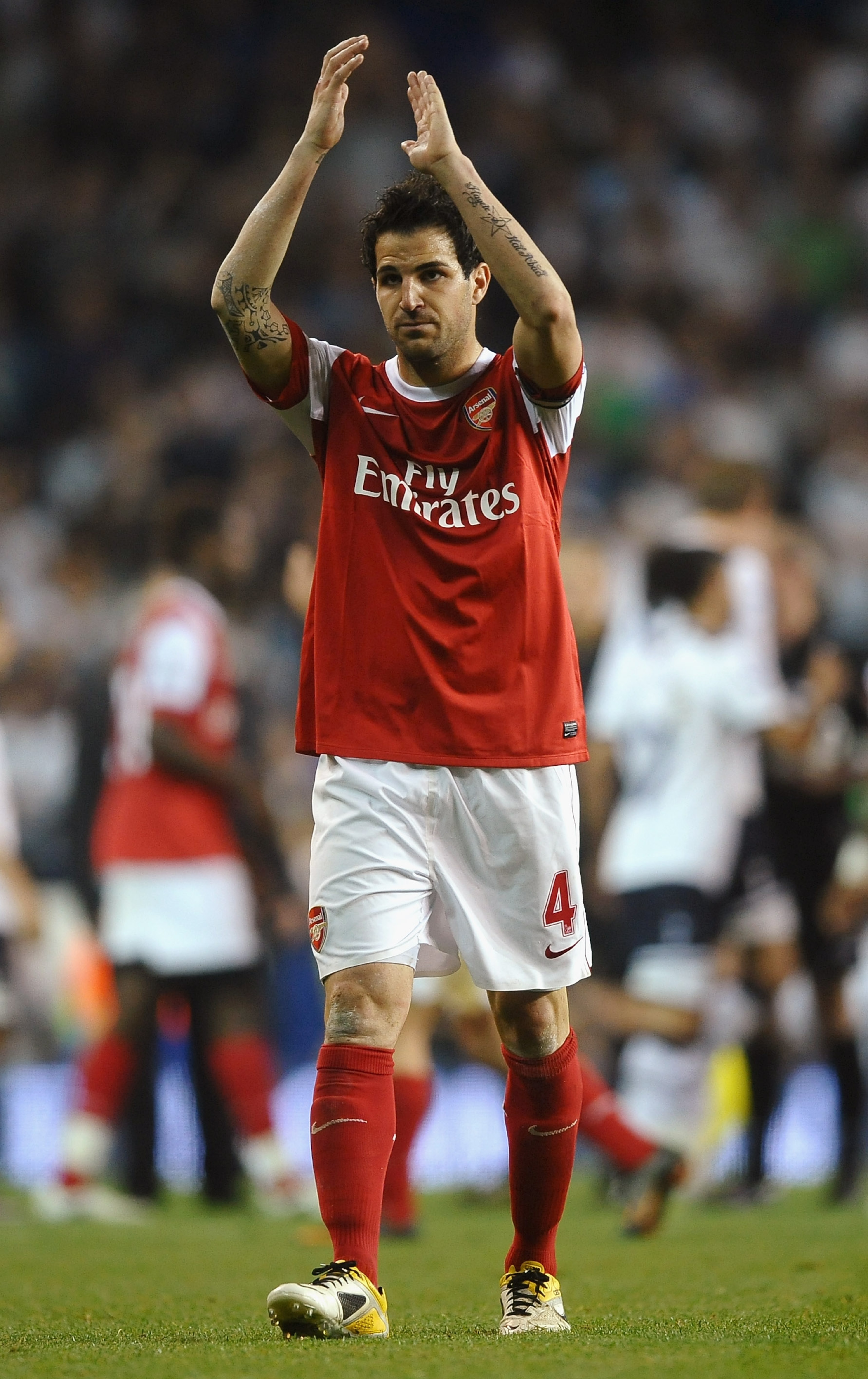 LONDON, ENGLAND - APRIL 20:  Cesc Fabregas of Arsenal applauds the fans during the Barclays Premier League match between Tottenham Hotspur and Arsenal at White Hart Lane on April 20, 2011 in London, England.  (Photo by Laurence Griffiths/Getty Images)