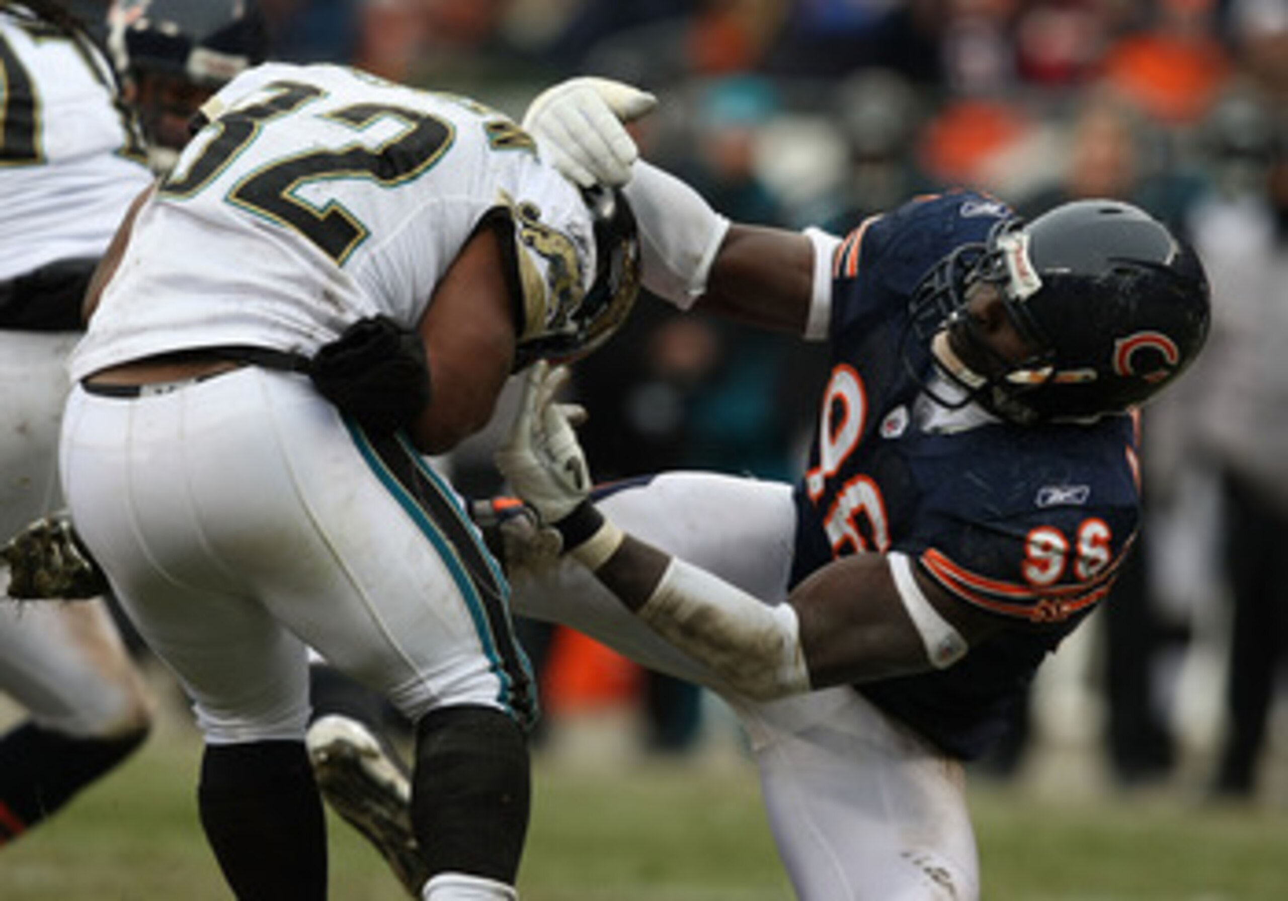 CHICAGO - DECEMBER 07: Alex Brown #96 of the Chicago Bears slows Maurice Jones-Drew #32 of the Jacksonville Jaguars on December 7, 2008 at Soldier Field in Chicago, Illinois. (Photo by Jonathan Daniel/Getty Images)