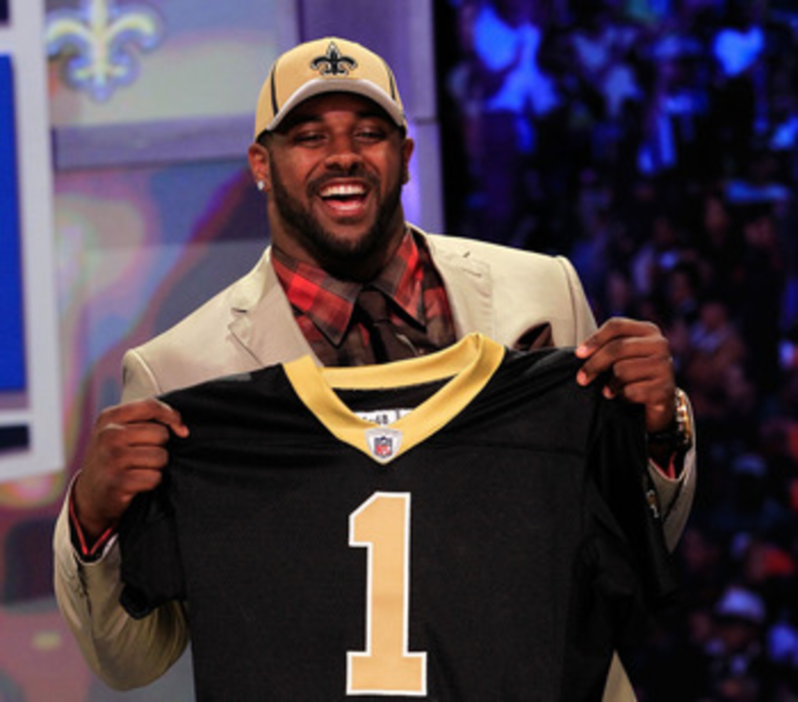 NEW YORK, NY - APRIL 28:  Cameron Jordan, #24 overall pick by the New Orleans Saints, holds up a jersey on stage during the 2011 NFL Draft at Radio City Music Hall on April 28, 2011 in New York City.  (Photo by Chris Trotman/Getty Images)