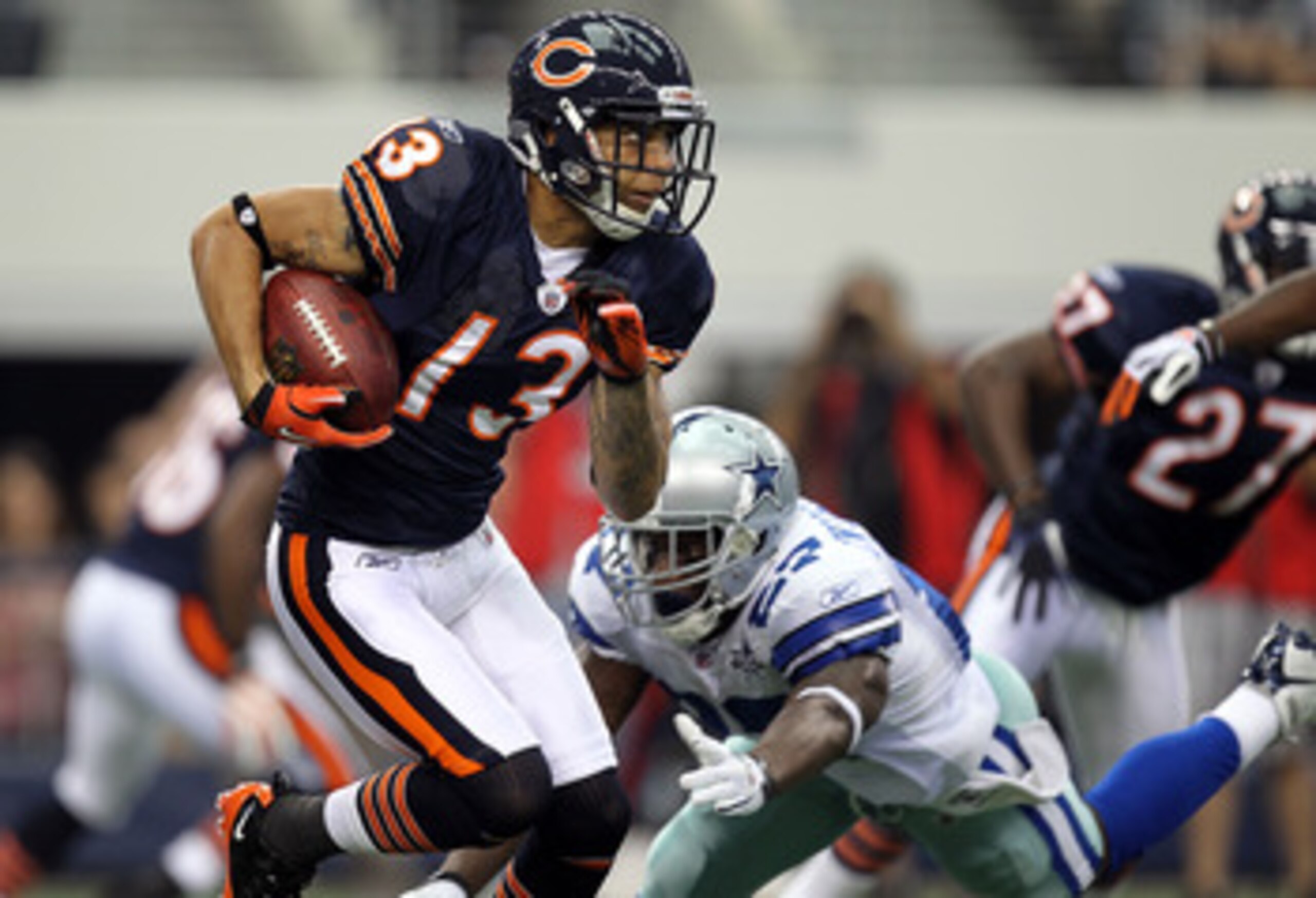 ARLINGTON, TX - SEPTEMBER 19:  Wide receiver Johnny Knox #13 of the Chicago Bears runs the ball against the Dallas Cowboys at Cowboys Stadium on September 19, 2010 in Arlington, Texas.  (Photo by Ronald Martinez/Getty Images)