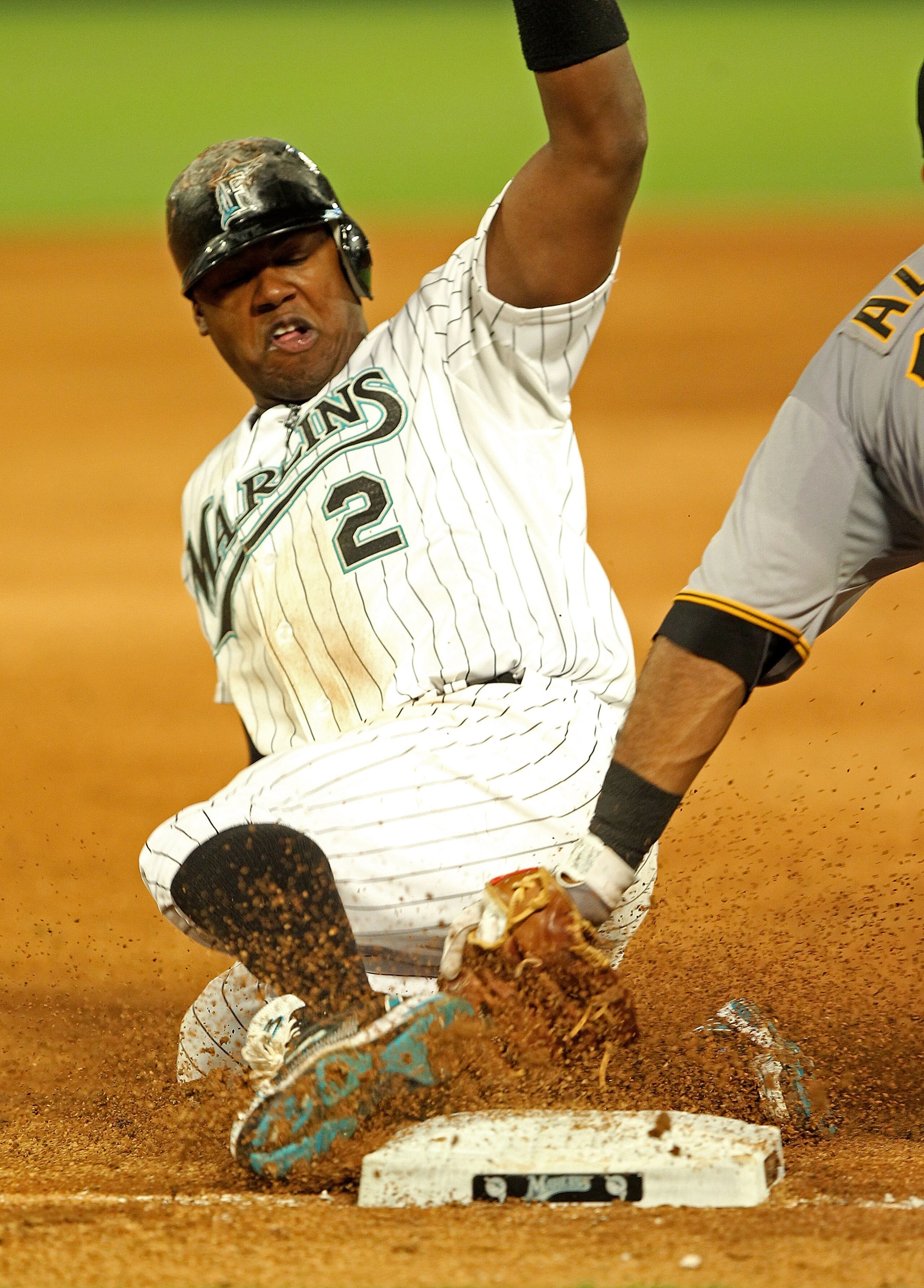 MIAMI GARDENS, FL - APRIL 21:  Hanley Ramirez #2 of the Florida Marlins is tagged out trying to steal third during a game against the Pittsburgh Pirates at Sun Life Stadium on April 21, 2011 in Miami Gardens, Florida.  (Photo by Mike Ehrmann/Getty Images)