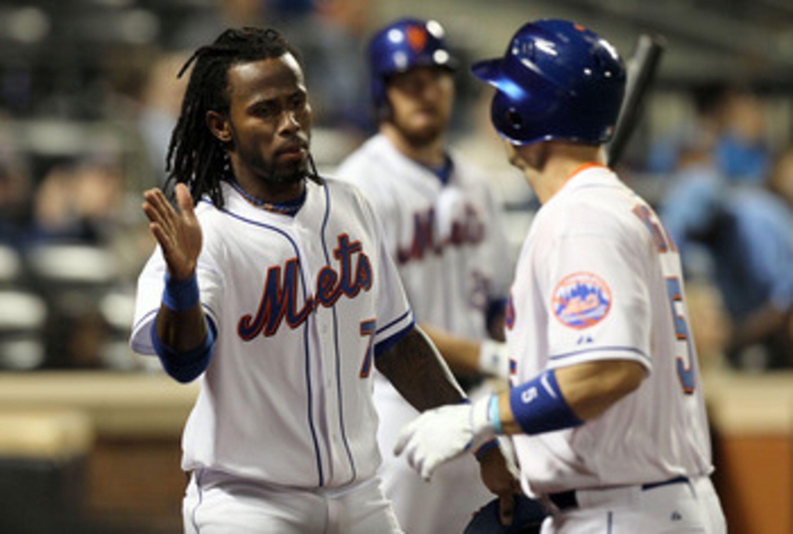 NEW YORK, NY - APRIL 11:  Jose Reyes #7 of the New York Mets celebrates after scoring a run in the third inning against the Colorado Rockies on a sacrifice fly by teammate David Wright #5 on April 11, 2011 at Citi Field in the Flushing neighborhood of the