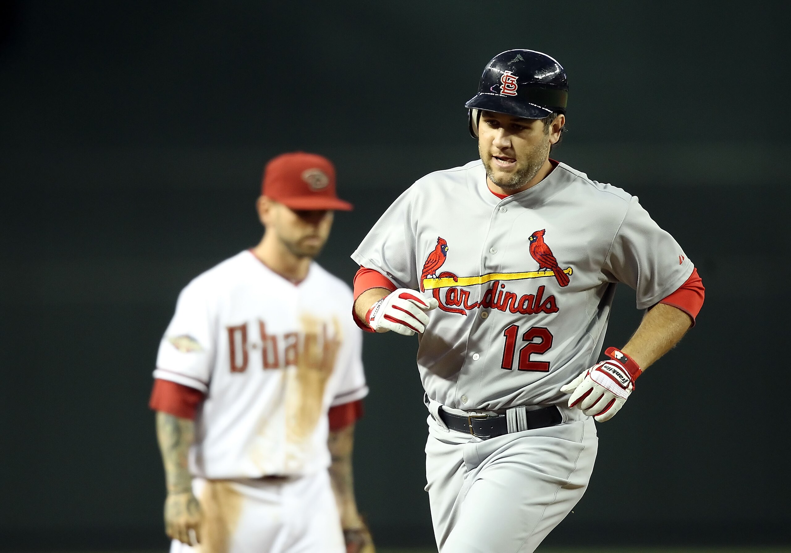 PHOENIX, AZ - APRIL 12:  Lance Berkman #12 of the St. Louis Cardinals rounds the bases after hitting a solo home run against the Arizona Diamondbacks during the second inning of the Major League Baseball game at Chase Field on April 12, 2011 in Phoenix, A