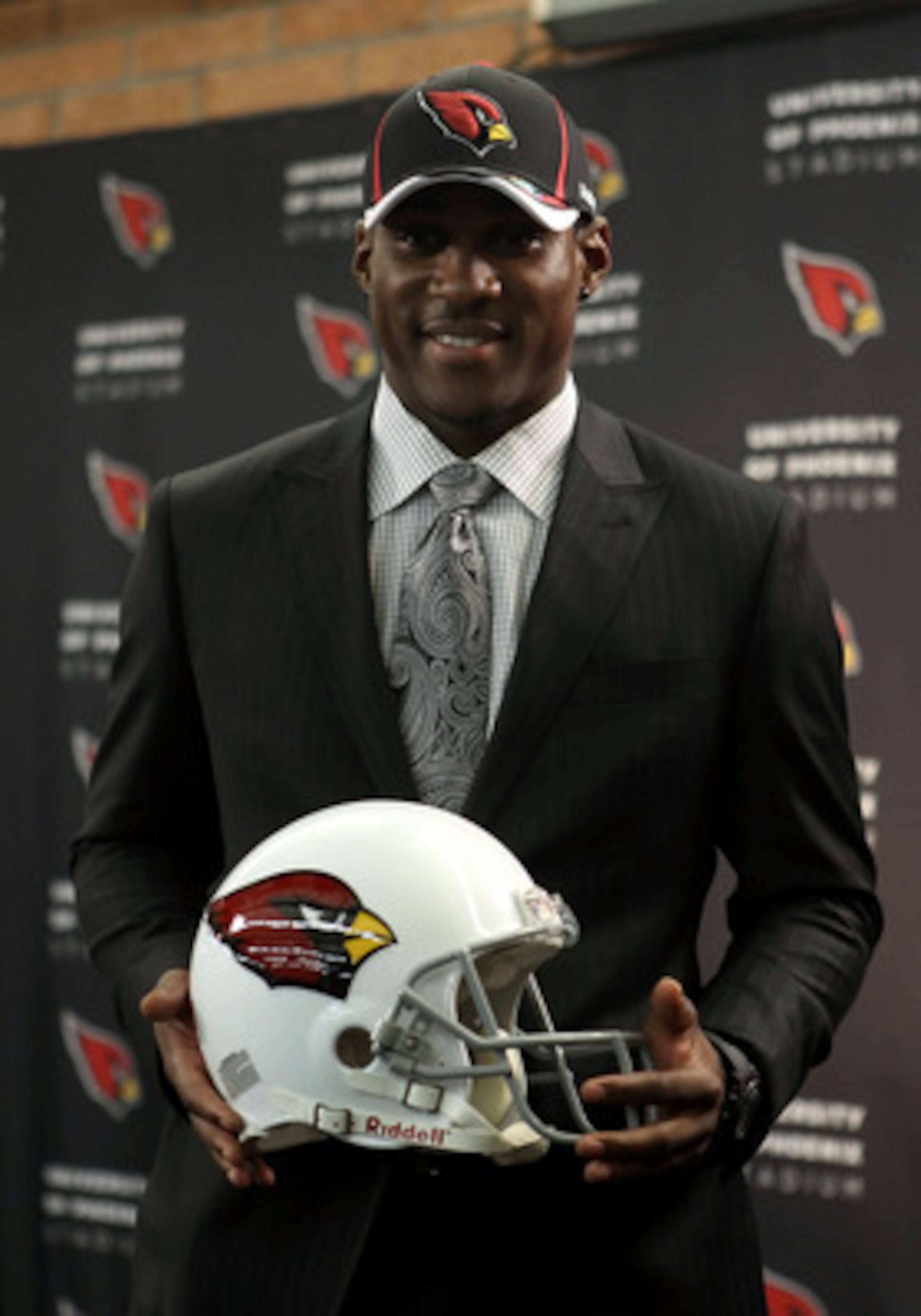 TEMPE, AZ - APRIL 29:  First round draft pick Patrick Peterson of the Arizona Cardinals poses with a team helmet during a press conference to introduce him at the team's training center auditorium on April 29, 2011 in Tempe, Arizona.  (Photo by Christian 