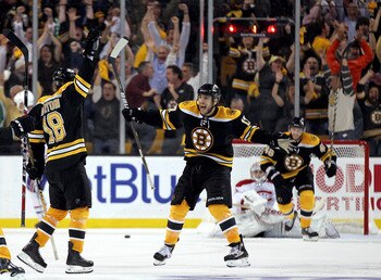BOSTON, MA - APRIL 27: Nathan Horton #18 of the Boston Bruins celebrates with Milan Lucic #17 after Horton scored the winning goal in overtime against the Montreal Canadiens in Game Seven of the Eastern Conference Quarterfinals during the 2011 NHL Stanley