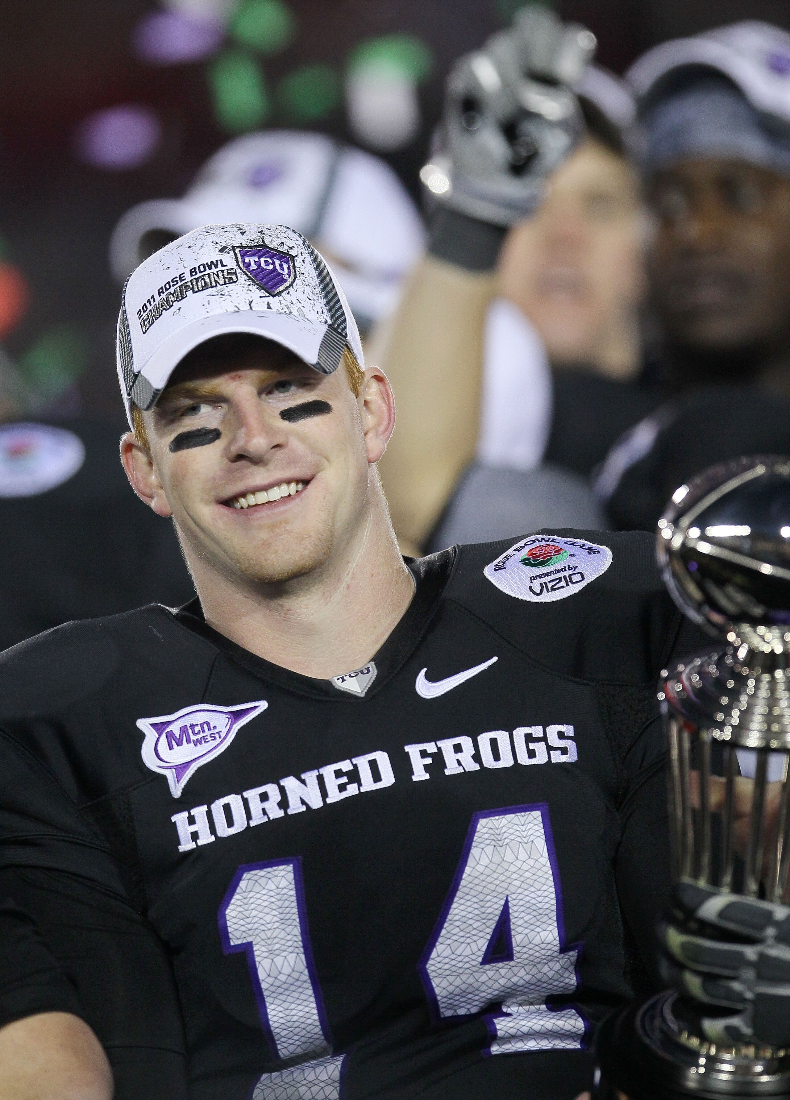 PASADENA, CA - JANUARY 01: Quarterback Andy Dalton #14 of the TCU Horned Frogs celebrates with the Rose Bowl Championship Trophy after defeating the Wisconsin Badgers 21-19 in the 97th Rose Bowl game on January 1, 2011 in Pasadena, California. (Photo by PASADENA, CA - JANUARY 01: Quarterback Andy Dalton #14 of the TCU Horned Frogs celebrates with the Rose Bowl Championship Trophy after defeating the Wisconsin Badgers 21-19 in the 97th Rose Bowl game on January 1, 2011 in Pasadena, California. (Photo by