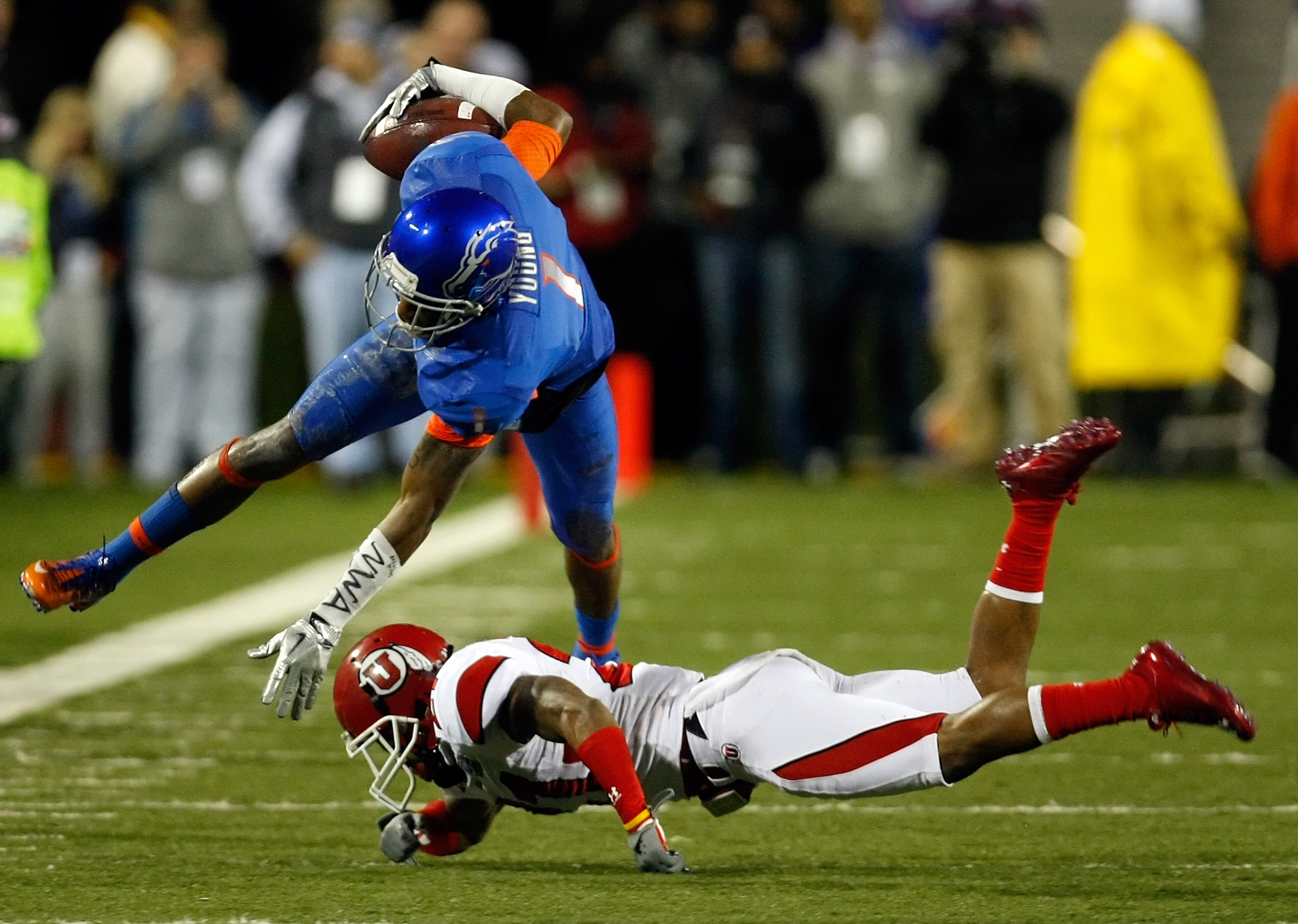 LAS VEGAS, NV - DECEMBER 22: Titus Young #1 of the Boise State Broncos is tripped up by Brian Blechen #2 of the Utah Utes during the MAACO Bowl Las Vegas at Sam Boyd Stadium December 22, 2010 in Las Vegas, Nevada. (Photo by Ethan Miller/Getty Images) LAS VEGAS, NV - DECEMBER 22: Titus Young #1 of the Boise State Broncos is tripped up by Brian Blechen #2 of the Utah Utes during the MAACO Bowl Las Vegas at Sam Boyd Stadium December 22, 2010 in Las Vegas, Nevada. (Photo by Ethan Miller/Getty Images)