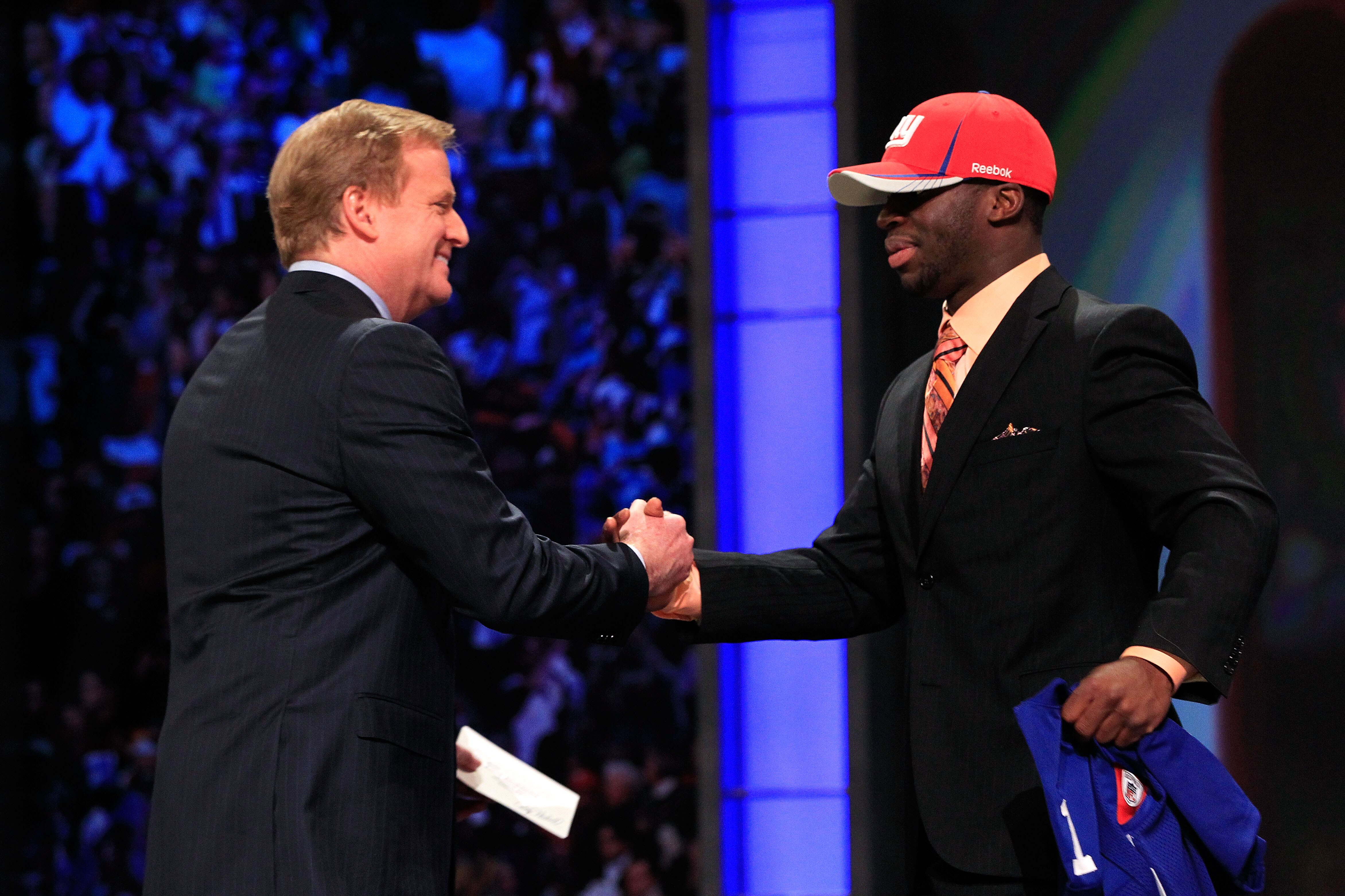 NEW YORK, NY - APRIL 28:  NFL Commissioner Roger Goodell (L) greets Prince Amukamara, #19 overall pick by the New York Giants, on stage during the 2011 NFL Draft at Radio City Music Hall on April 28, 2011 in New York City.  (Photo by Chris Trotman/Getty I