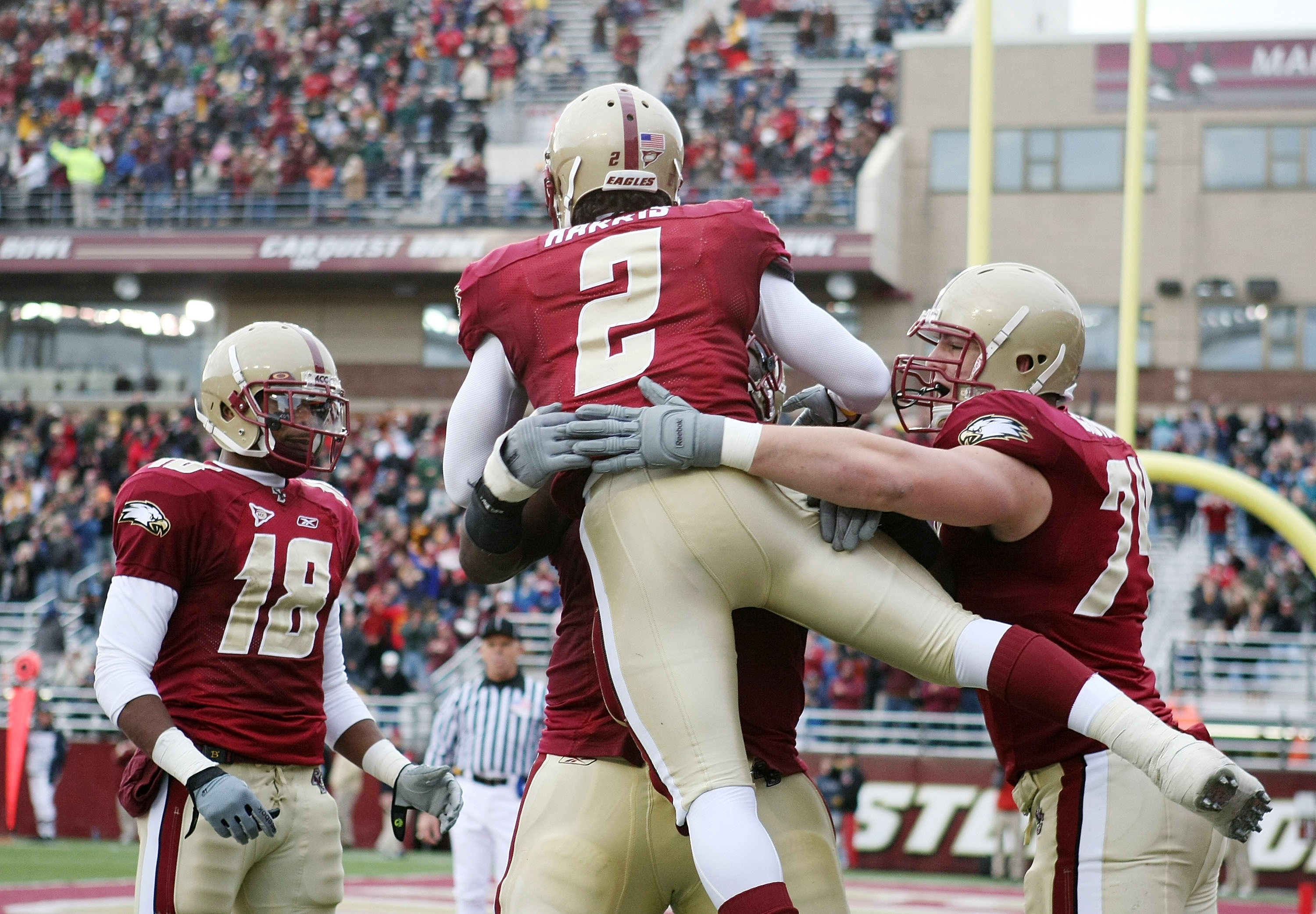 CHESTNUT HILL, MA - OCTOBER 17:  Montell Harris #2  of the Boston College Eagles celebrates his touchdown with teammates Rich Gunnell #18, Anthony Castonzo #74 and  Thomas Claiborne #78 in the second quarter against the North Carolina State Wolf Pack on O