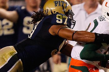 PITTSBURGH - SEPTEMBER 23:  Jacory Harris #12 of the Miami Hurricanes is tackled by Jabaal Sheard #97 of the Pittsburgh Panthers on September 23, 2010 at Heinz Field in Pittsburgh, Pennsylvania.  (Photo by Jared Wickerham/Getty Images)
