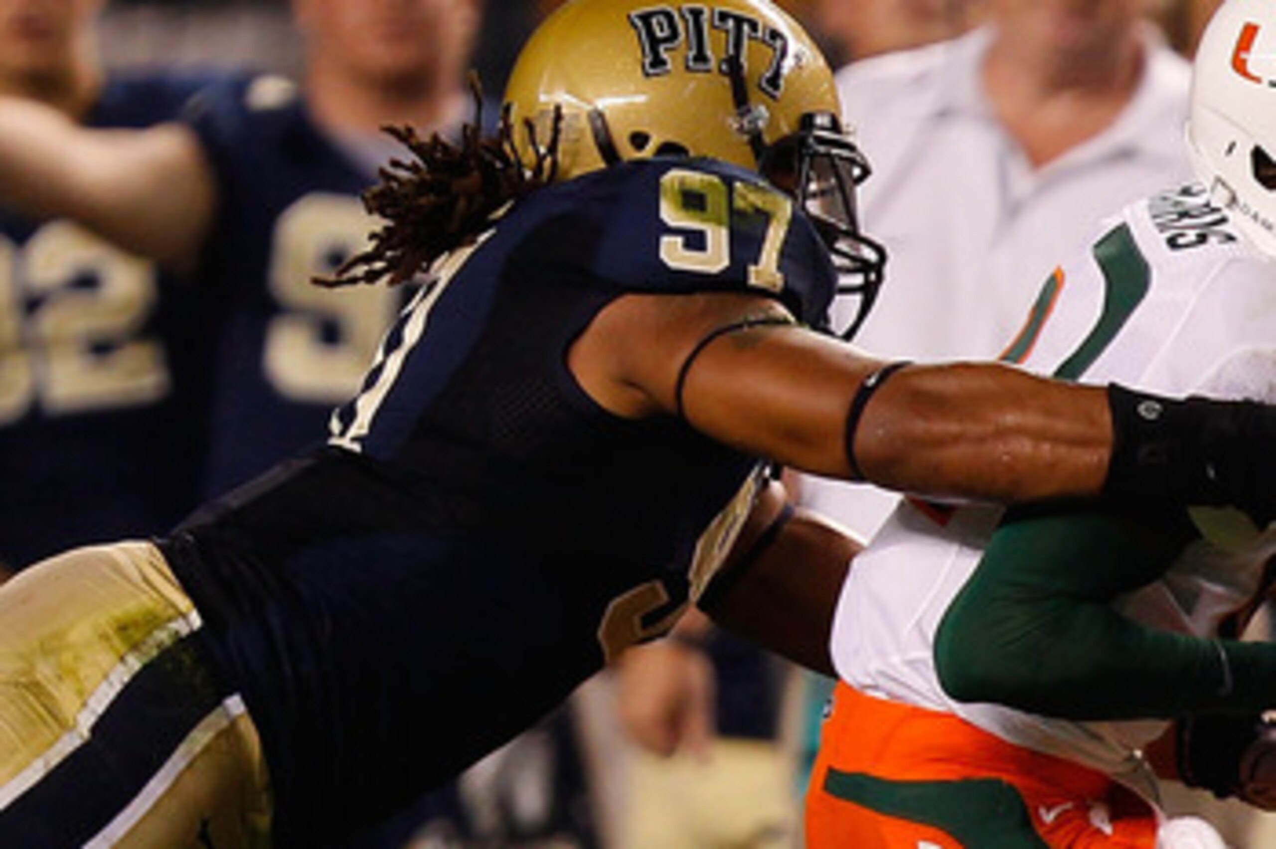 PITTSBURGH - SEPTEMBER 23:  Jacory Harris #12 of the Miami Hurricanes is tackled by Jabaal Sheard #97 of the Pittsburgh Panthers on September 23, 2010 at Heinz Field in Pittsburgh, Pennsylvania.  (Photo by Jared Wickerham/Getty Images)