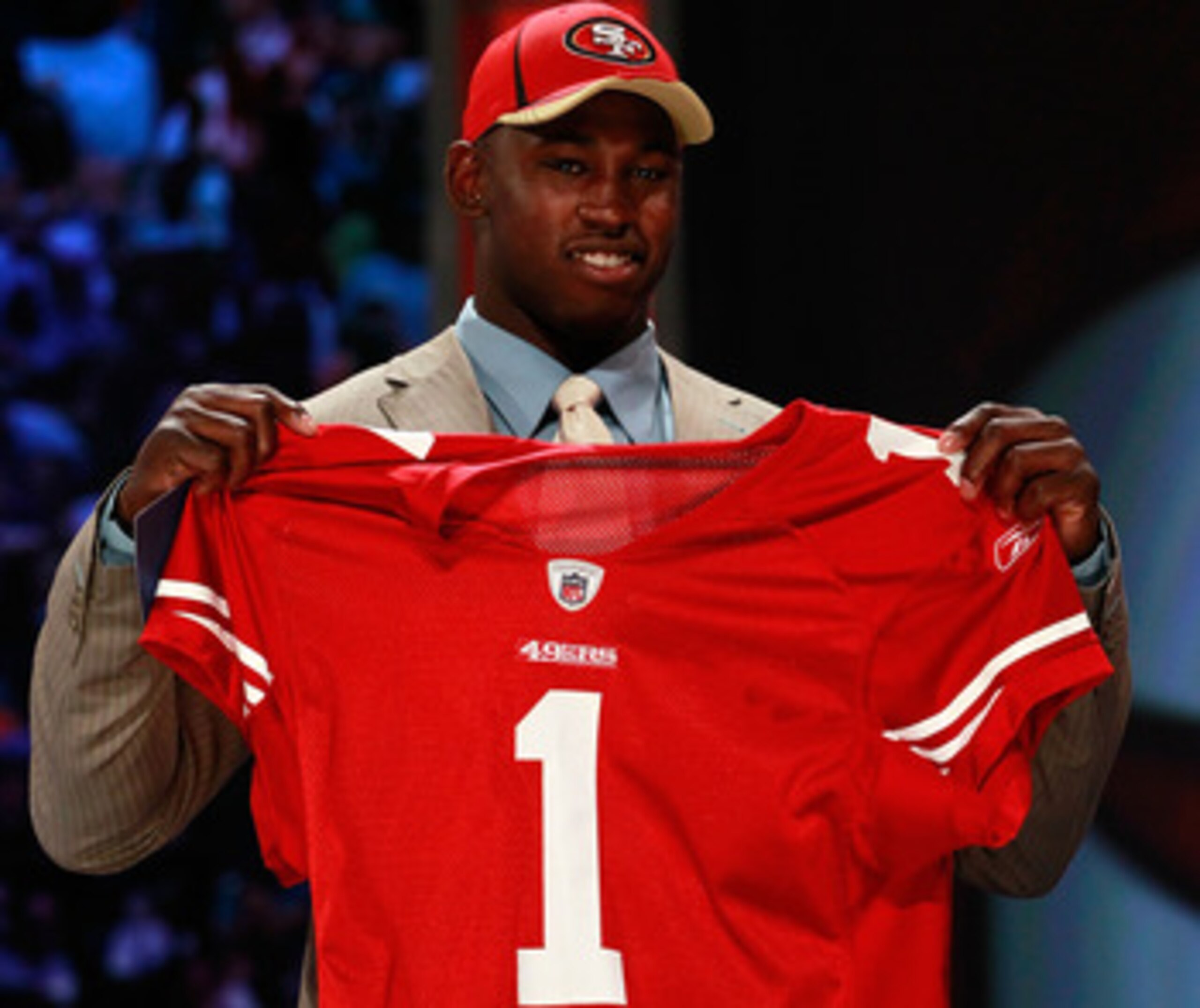 NEW YORK, NY - APRIL 28:  Aldon Smith, #7 overall pick by the San Francisco 49ers, holds up a jersey on stage during the 2011 NFL Draft at Radio City Music Hall on April 28, 2011 in New York City.  (Photo by Chris Trotman/Getty Images)