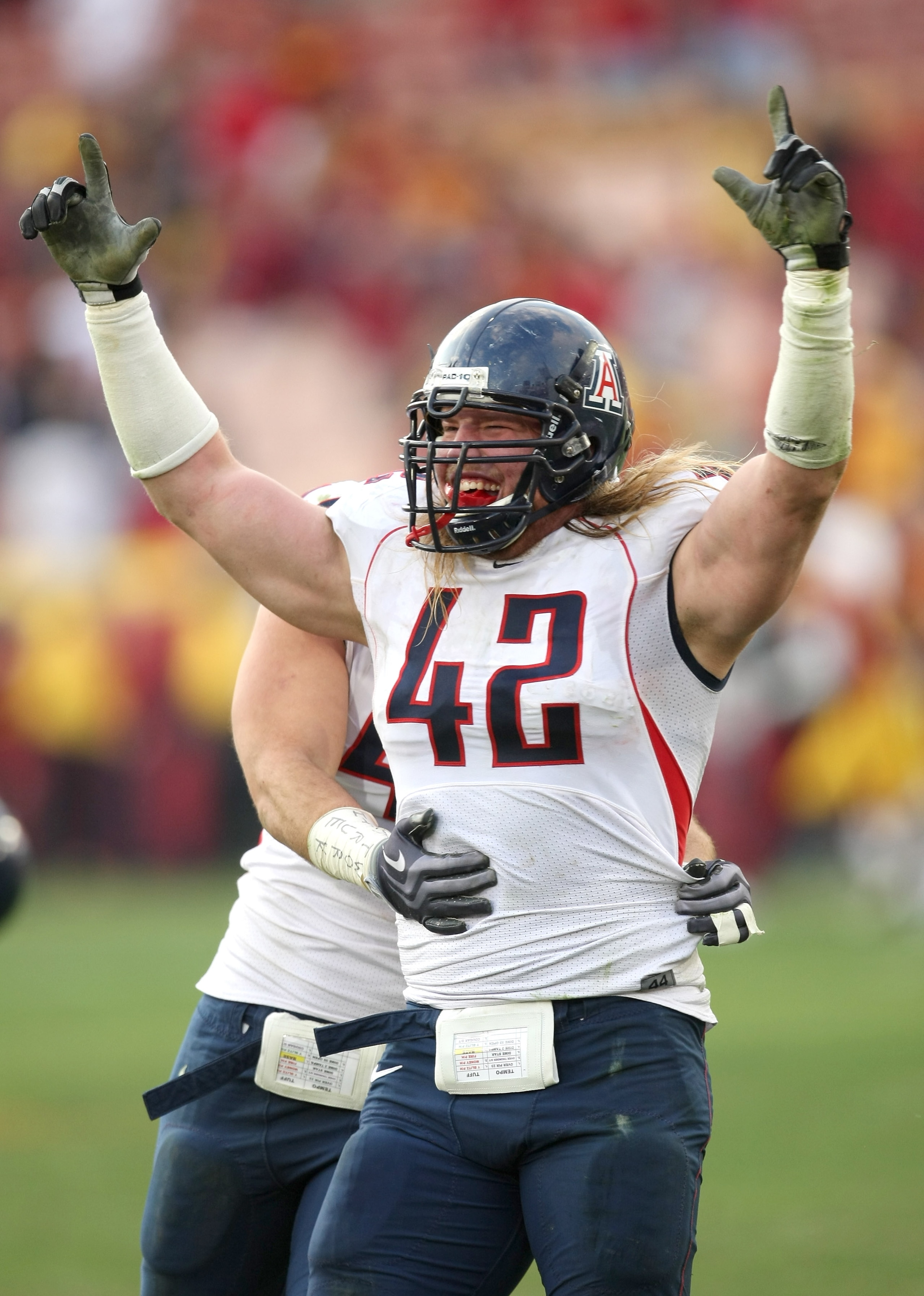 LOS ANGELES, CA - DECEMBER 05: Defensive end Brooks Reed #42 of the Arizona Wildcats celebrates after stopping the USC Trojans on the final play on December 5, 2009 at the Los Angeles Coliseum in Los Angeles, California. Arizona won 21-17. (Photo by Ste LOS ANGELES, CA - DECEMBER 05: Defensive end Brooks Reed #42 of the Arizona Wildcats celebrates after stopping the USC Trojans on the final play on December 5, 2009 at the Los Angeles Coliseum in Los Angeles, California. Arizona won 21-17. (Photo by Ste