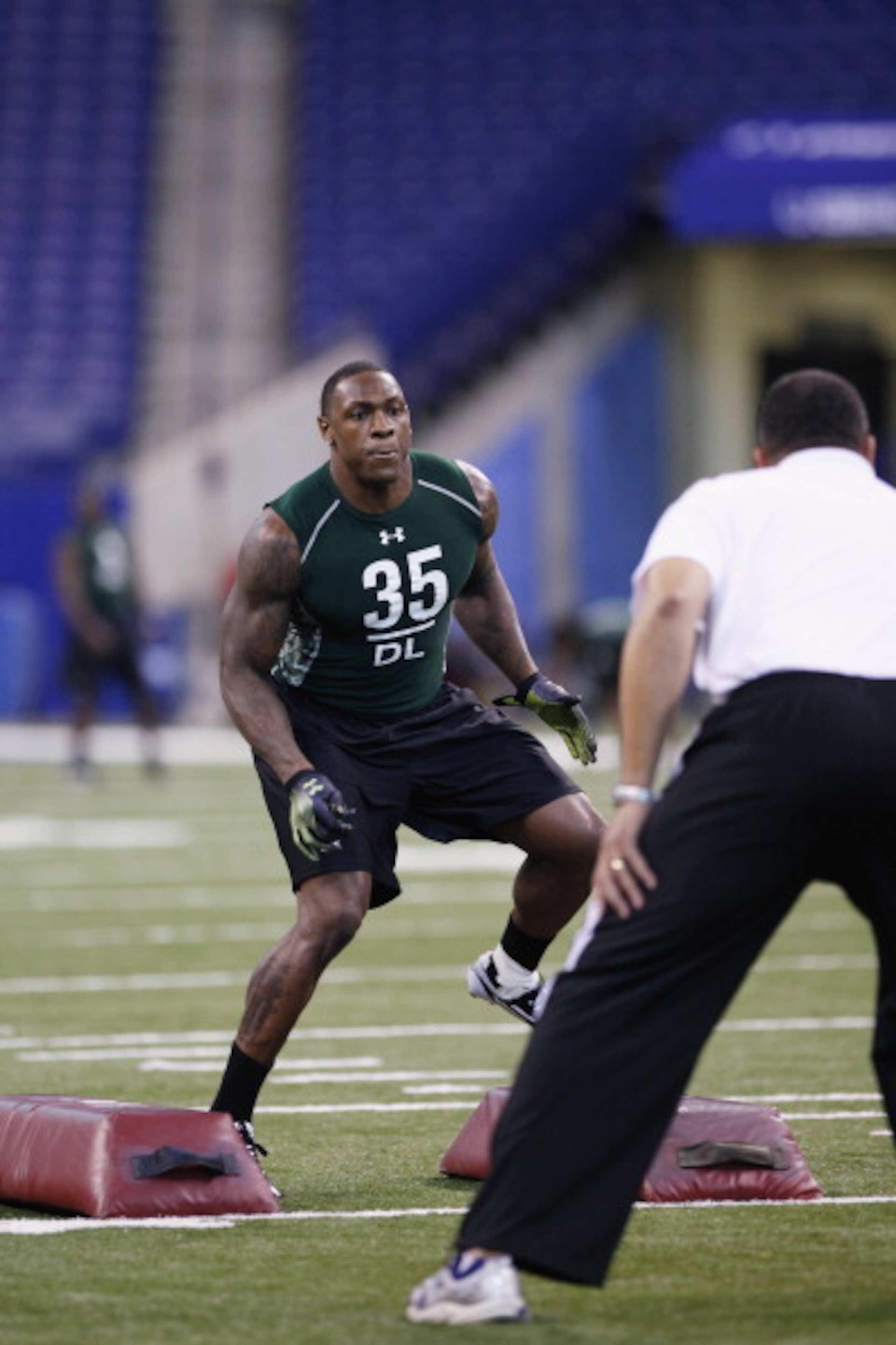 INDIANAPOLIS, IN - FEBRUARY 28: Defensive lineman Dontay Moch of Nevada runs a drill during the 2011 NFL Scouting Combine at Lucas Oil Stadium on February 28, 2011 in Indianapolis, Indiana. (Photo by Joe Robbins/Getty Images) INDIANAPOLIS, IN - FEBRUARY 28: Defensive lineman Dontay Moch of Nevada runs a drill during the 2011 NFL Scouting Combine at Lucas Oil Stadium on February 28, 2011 in Indianapolis, Indiana. (Photo by Joe Robbins/Getty Images)