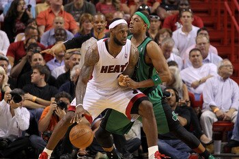 MIAMI, FL - APRIL 10:  LeBron James #6 of the Miami Heat posts up Paul Pierce #34 of the Boston Celtics during a game  at American Airlines Arena on April 10, 2011 in Miami, Florida. NOTE TO USER: User expressly acknowledges and agrees that, by downloadin