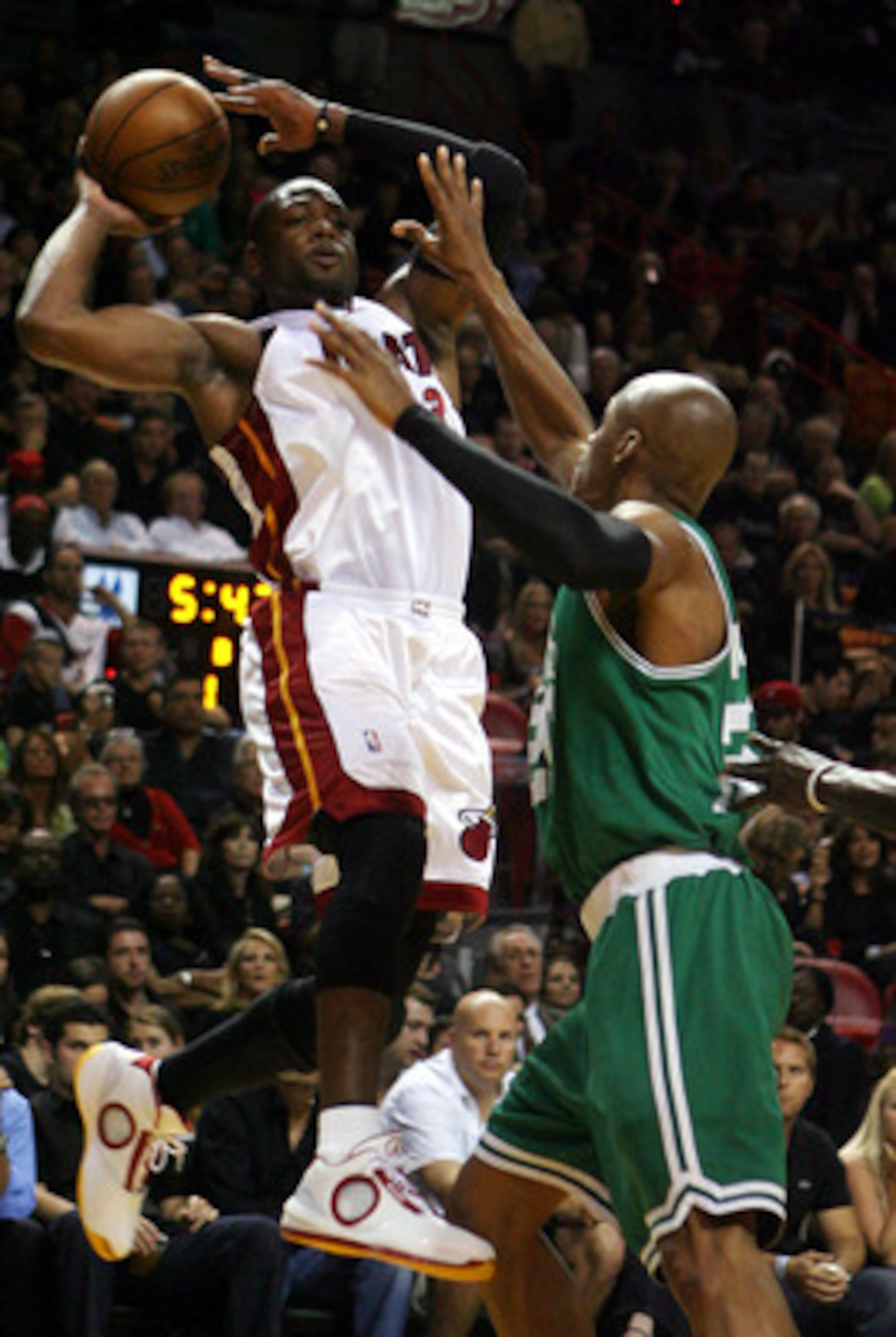 MIAMI - APRIL 23:  Guard Ray Allen #20 of the Boston Celtics defends guard Dwyane Wade #3 of the Miami Heat in Game Three of the Eastern Conference Quarterfinals during the 2010 NBA Playoffs at American Airlines Arena on April 23, 2010 in Miami, Florida. 
