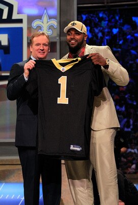 NEW YORK, NY - APRIL 28:  NFL Commissioner Roger Goodell (L) poses for a photo with Cameron Jordan, #24 overall pick by the New Orleans Saints, holds up a jersey on stage during the 2011 NFL Draft at Radio City Music Hall on April 28, 2011 in New York Cit