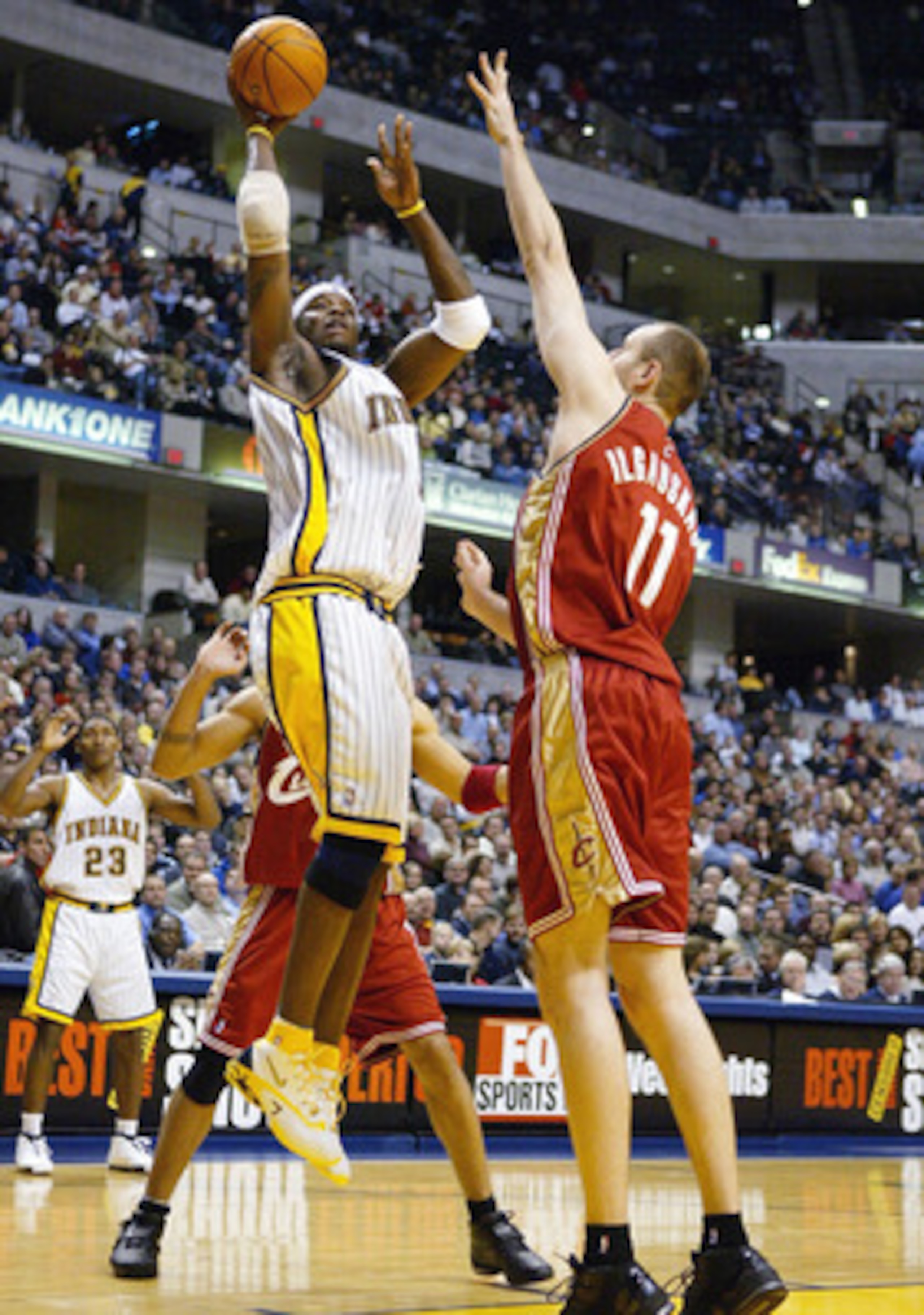 INDIANAPOLIS - DECEMBER 15:  Jermaine O'Neal #7 of the Indiana Pacers shoots the ball while being defended by Zydrunas Ilgauskas #11 of the Cleveland Cavaliers in NBA action December15, 2003 at Conseco Fieldhouse in Indianapolis, Indiana. NOTE TO USER: Us